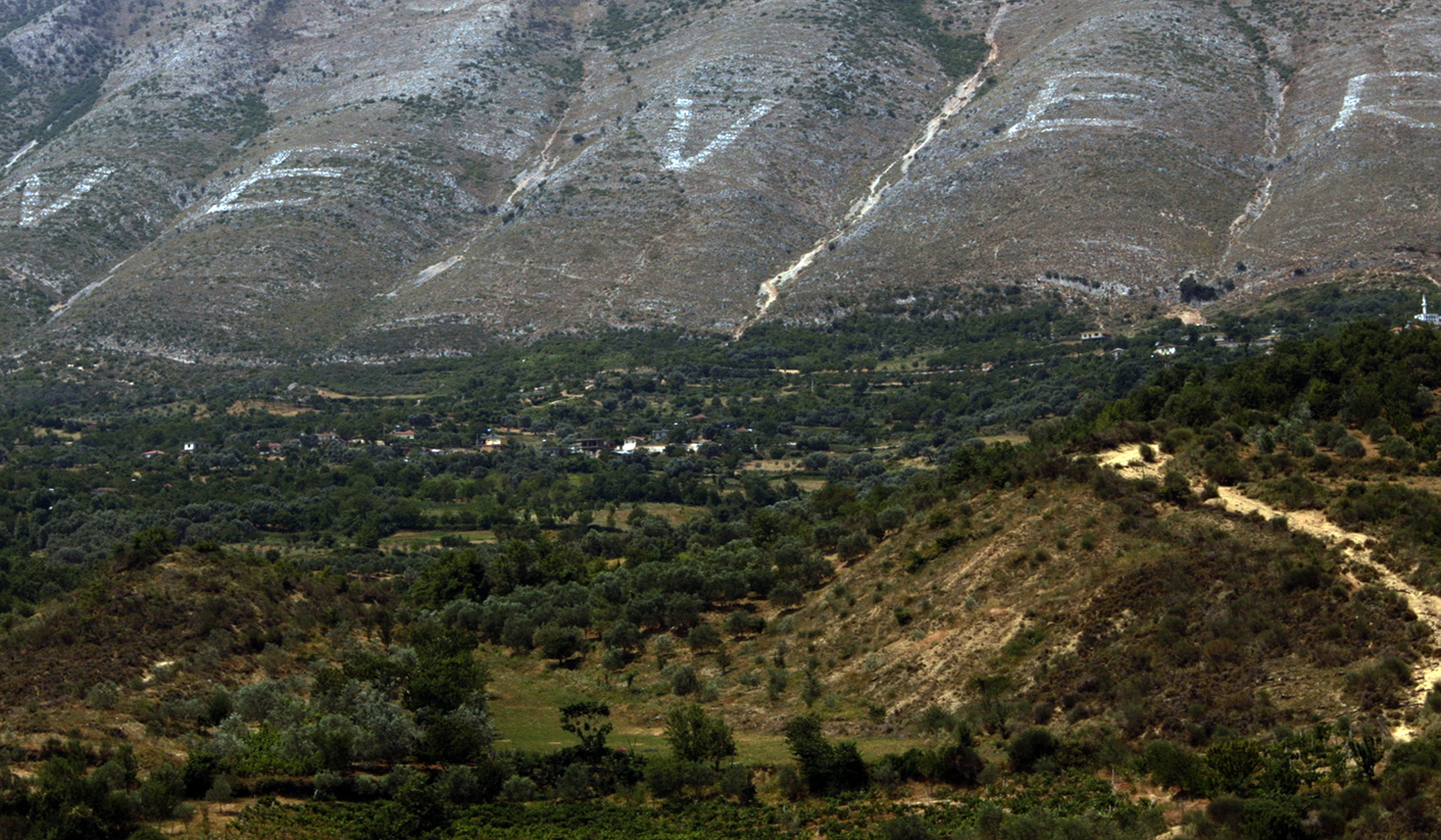 'NEVER' again, despot's name wiped from Albanian mountain