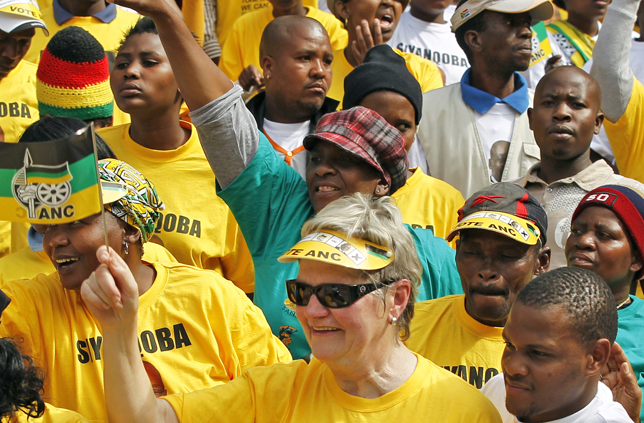 Supporters of the ruling party African National Congress (ANC) cheer during their final rally in Soweto