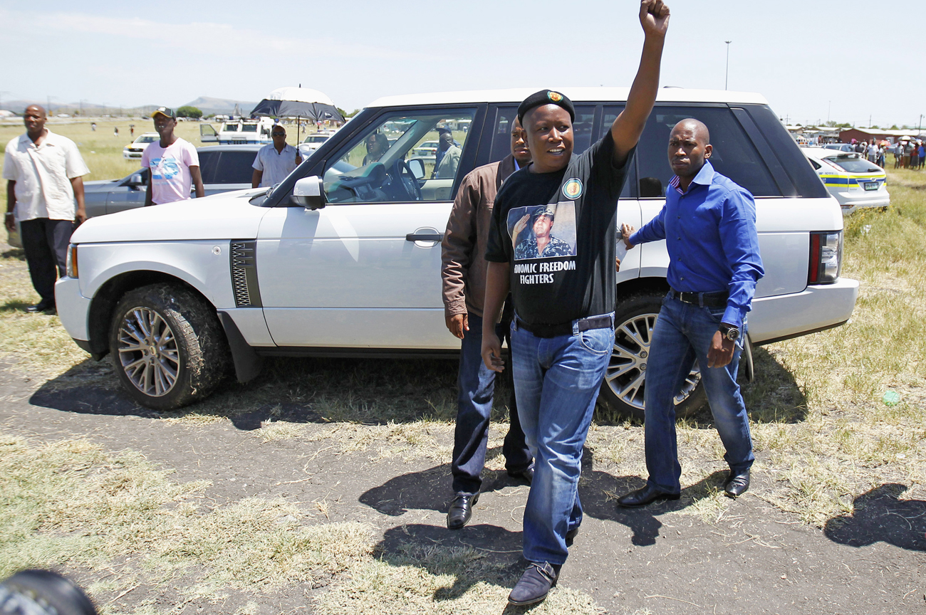 Suspended ANC Youth League President Julius Malema arrives to address miners on strike outside the Impala platinum mine in Rustenburg