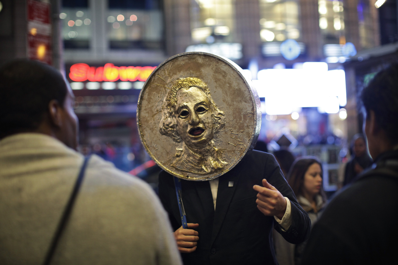 An Occupy Wall Street protester argues with pedestrians at the end of a protest at Times Square in New York