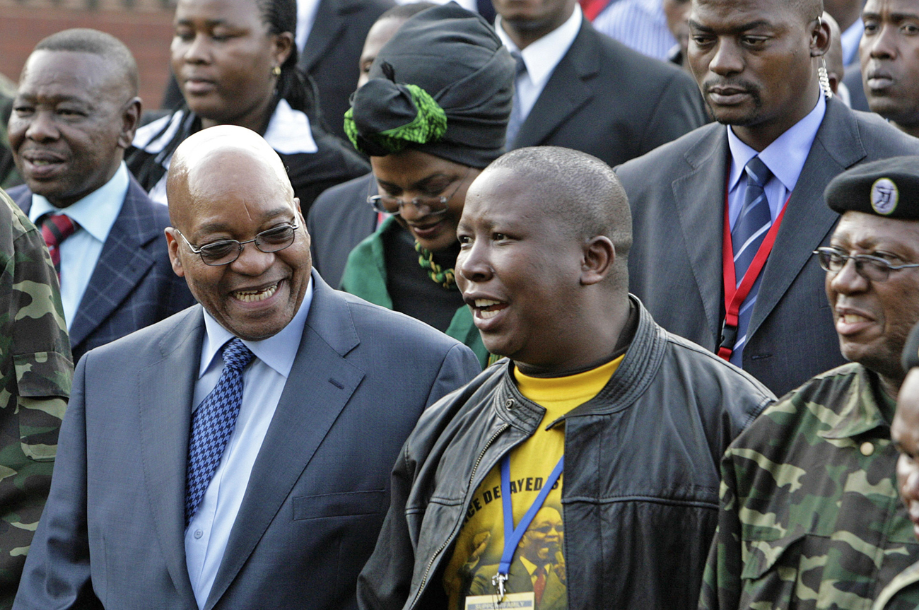 Zuma, leader of South Africa's ruling ANC, chats with Malema, president of ANCYL, at the Pietermaritzburg high court outside Durban