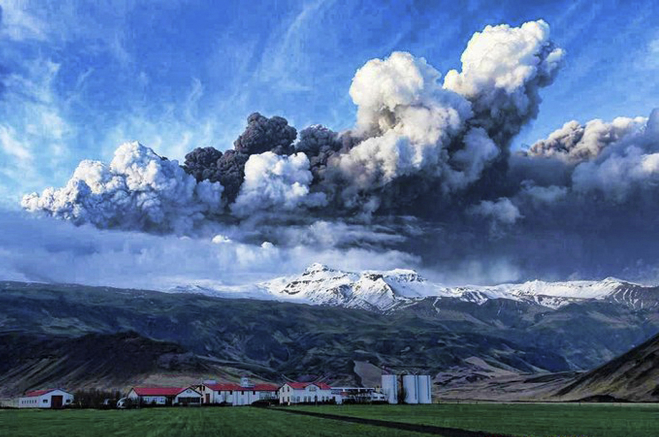 A plume of volcanic ash rises into the atmosphere from a crater under about 656 feet (200 metres) of ice at the Eyjafjallajokull glacier