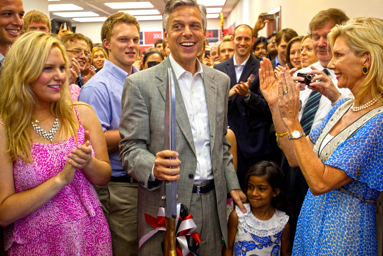 Republican candidate for US President Huntsman reacts to cutting the ribbon at his national campaign headquarters in Orlando