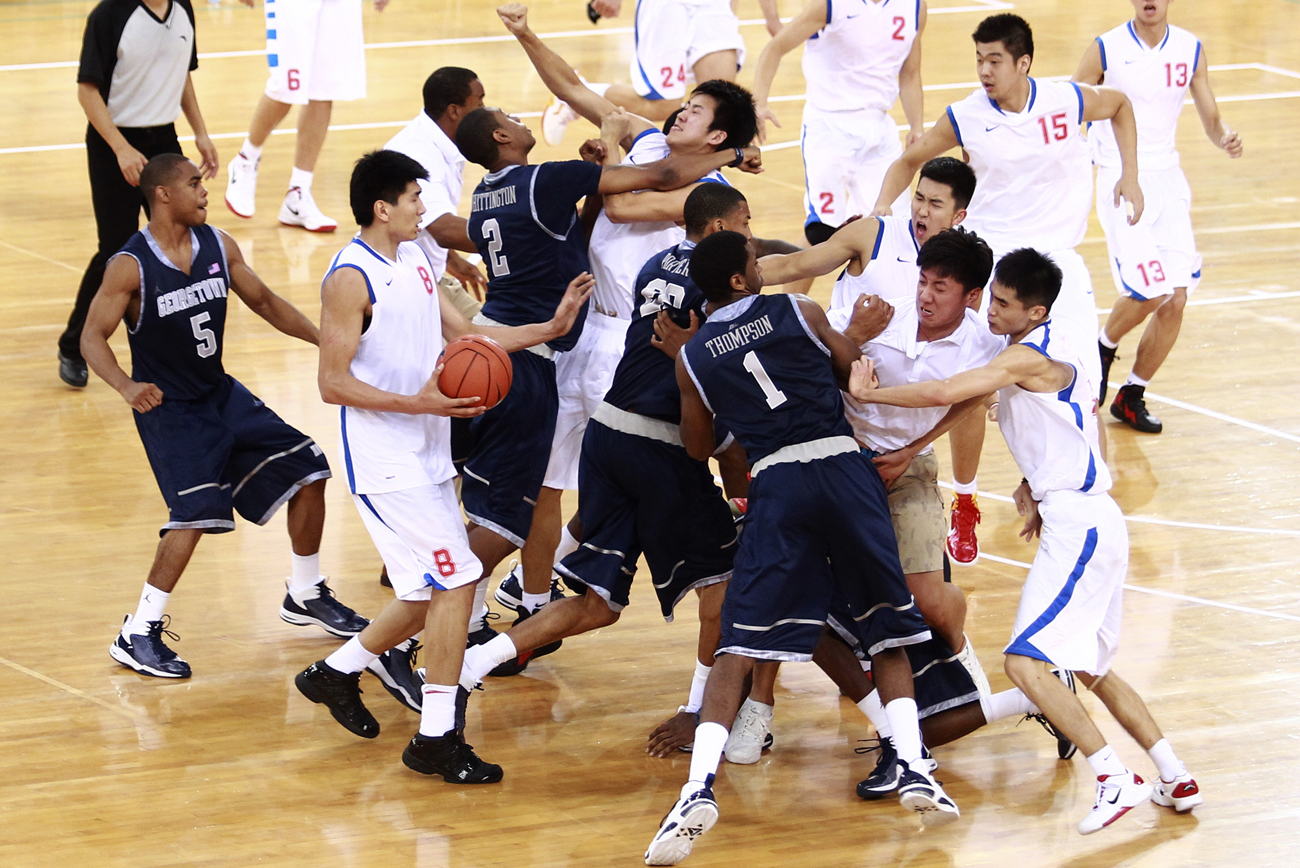 American Georgetown University men's basketball team and China's Bayi men's basketball team fight during a friendly game at Beijing Olympic Basketball Arena