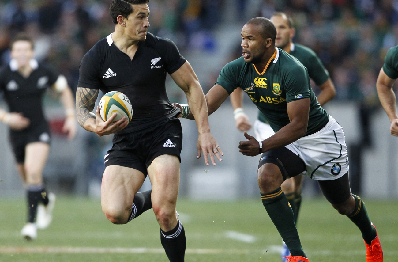 Williams of New Zealand's All Blacks is tackled by Petersen of South Africa's Springboks during their Tri-Nations rugby union match in Port Elizabeth