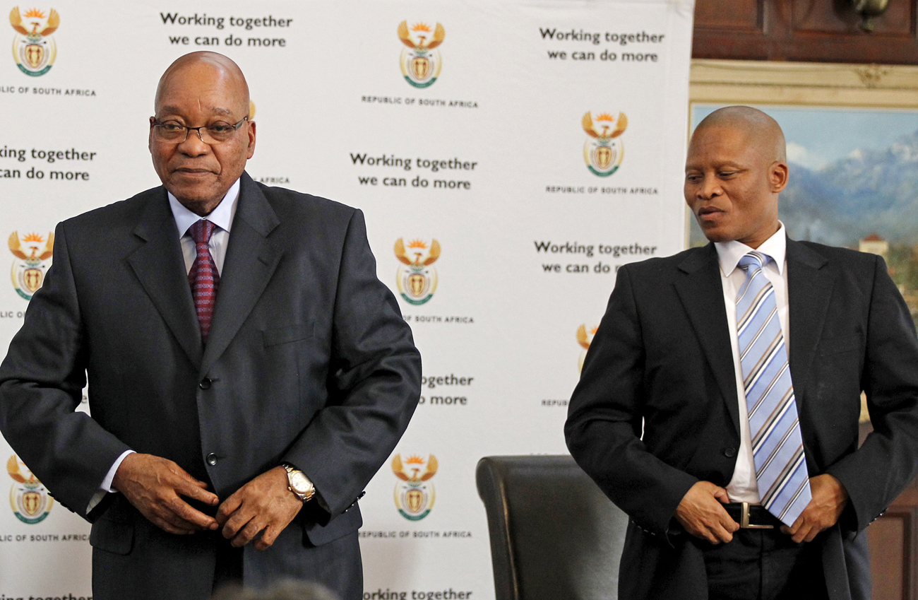 South Africa's president Jacob Zuma stands with Justice Mogoeng Mogoeng after Zuma appointed him as new Chief Justice of South Africa at presidential guest house in Pretoria