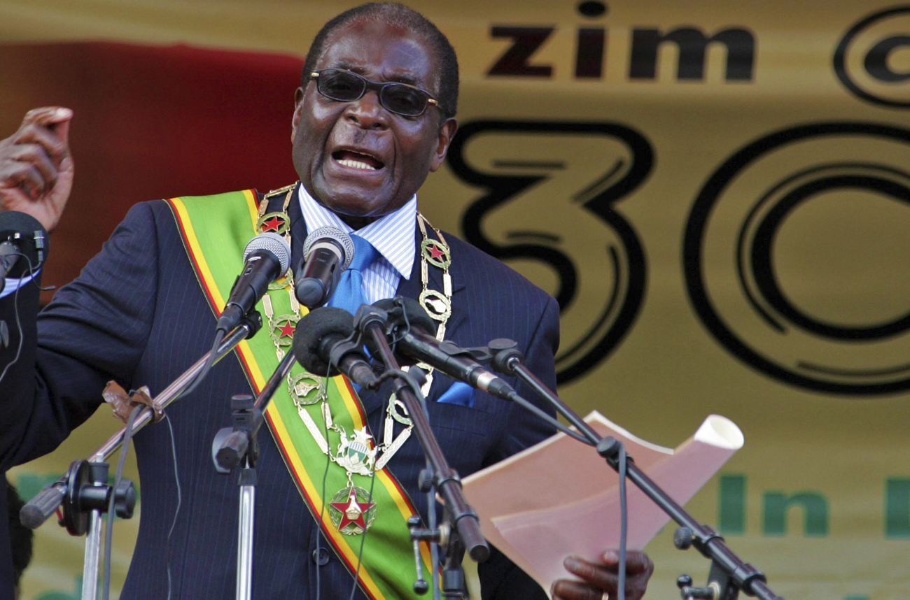 Zimbabwe's President Mugabe speaks as crowds gather at a rally in Harare to mark the country's 30 years of independence from Britain