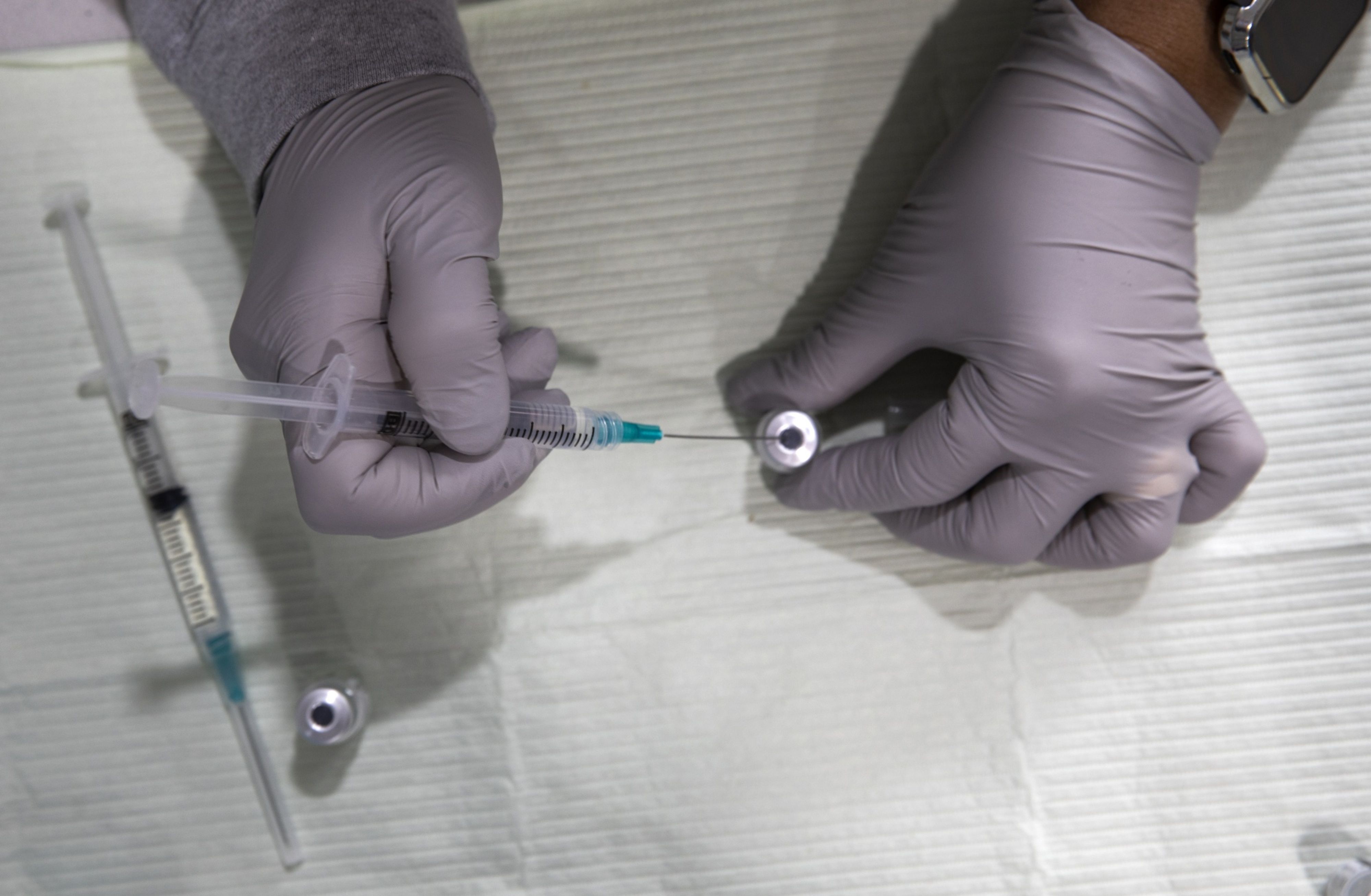 Healthcare Workers Administer Covid-19 Vaccines At Airport As U.S. Daily Cases Hit 14-Month Low