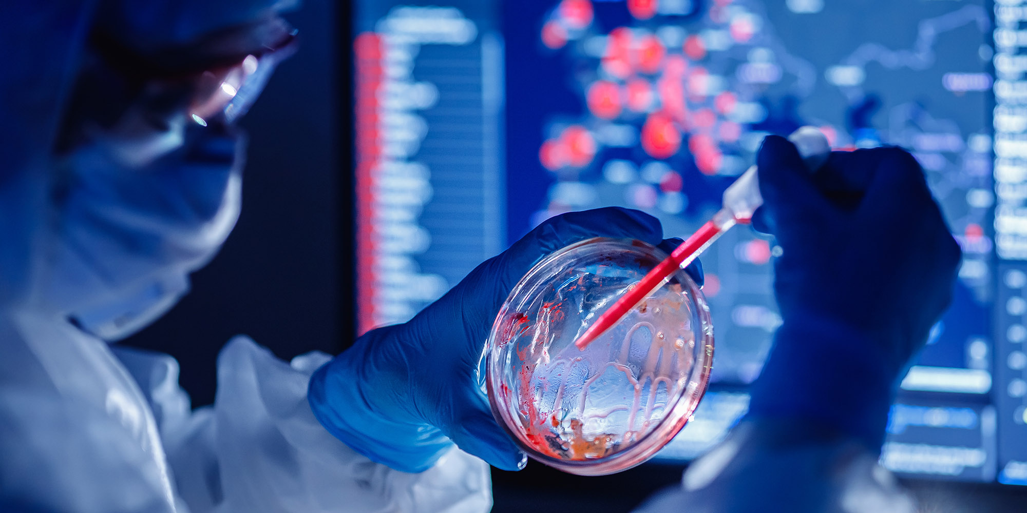 Medical bioengineer working on development vaccines 2019-ncov coronavirus in pharmacy laboratory. Blue colour background