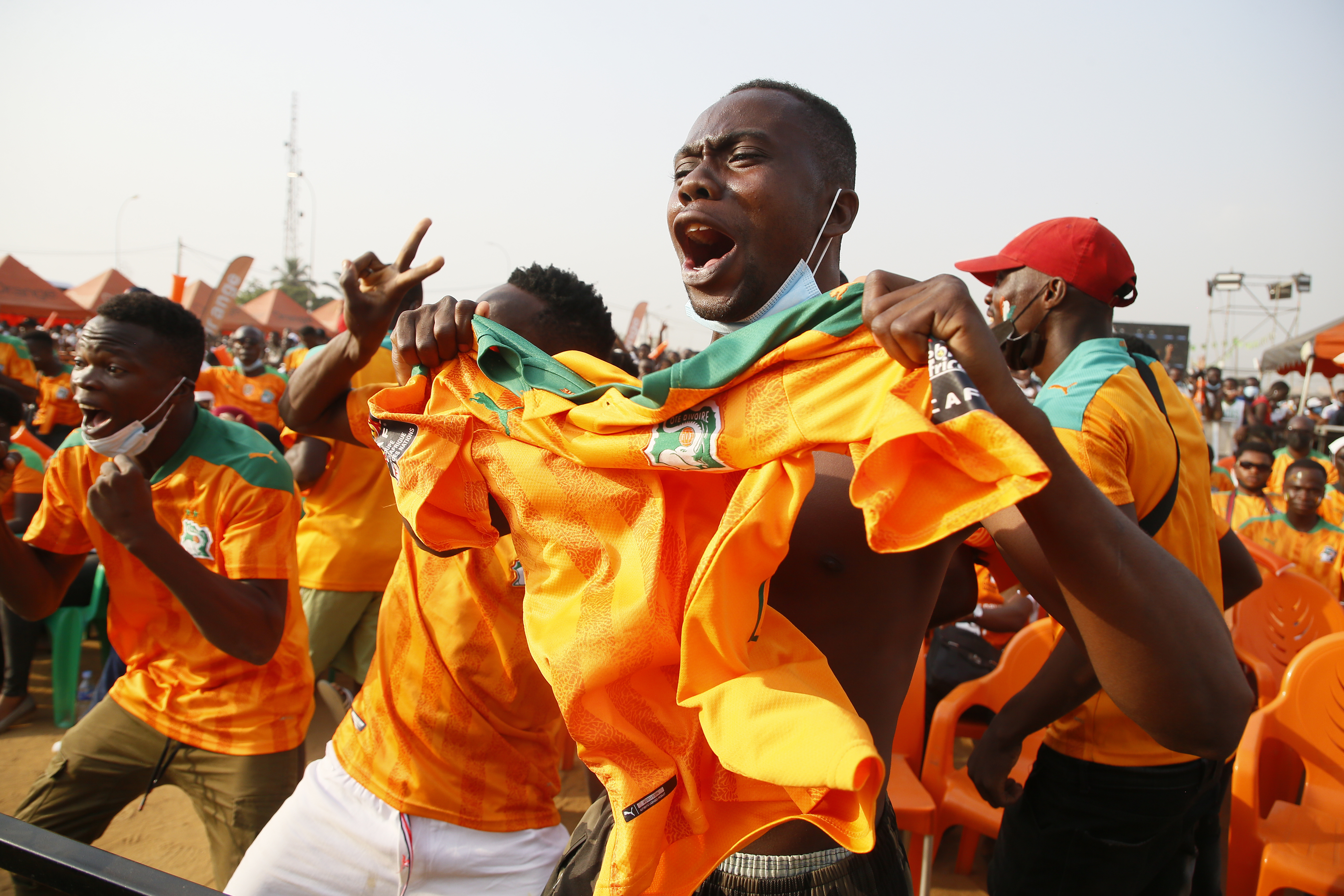 Ivorian soccer fans watch the broadcast of a 2021 Africa Cup of Nations match