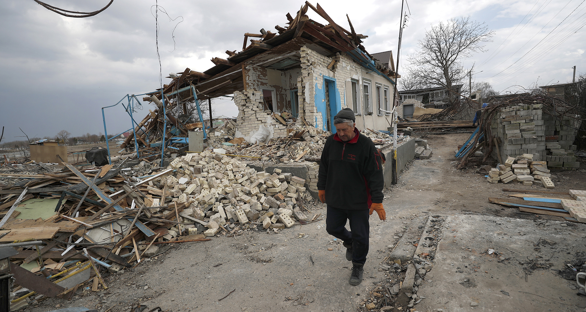 Macron presses Putin for humanitarian corridor; Moscow says it will reduce military operations