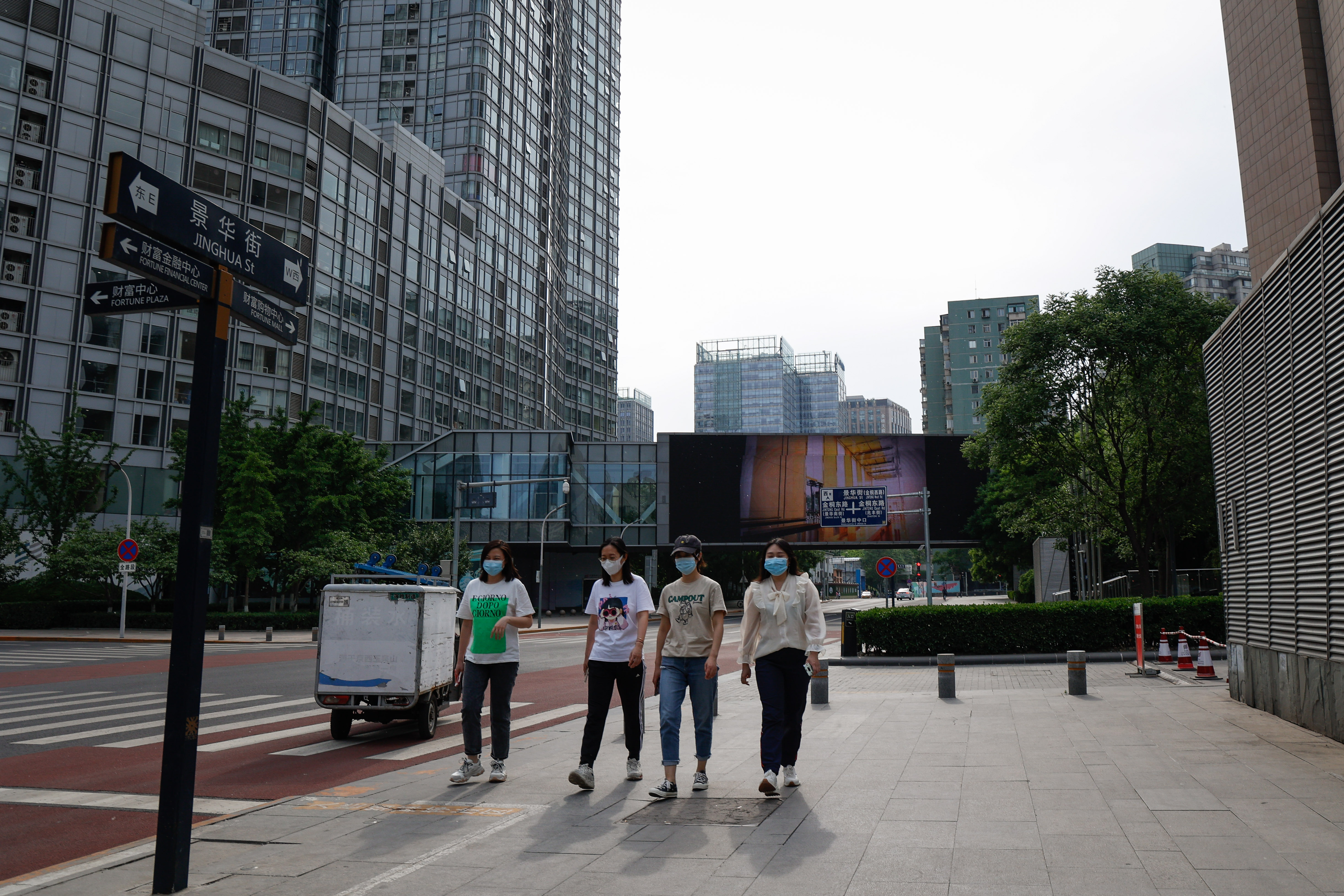 Beijing urges people to work from home to curb spread of COVID-19