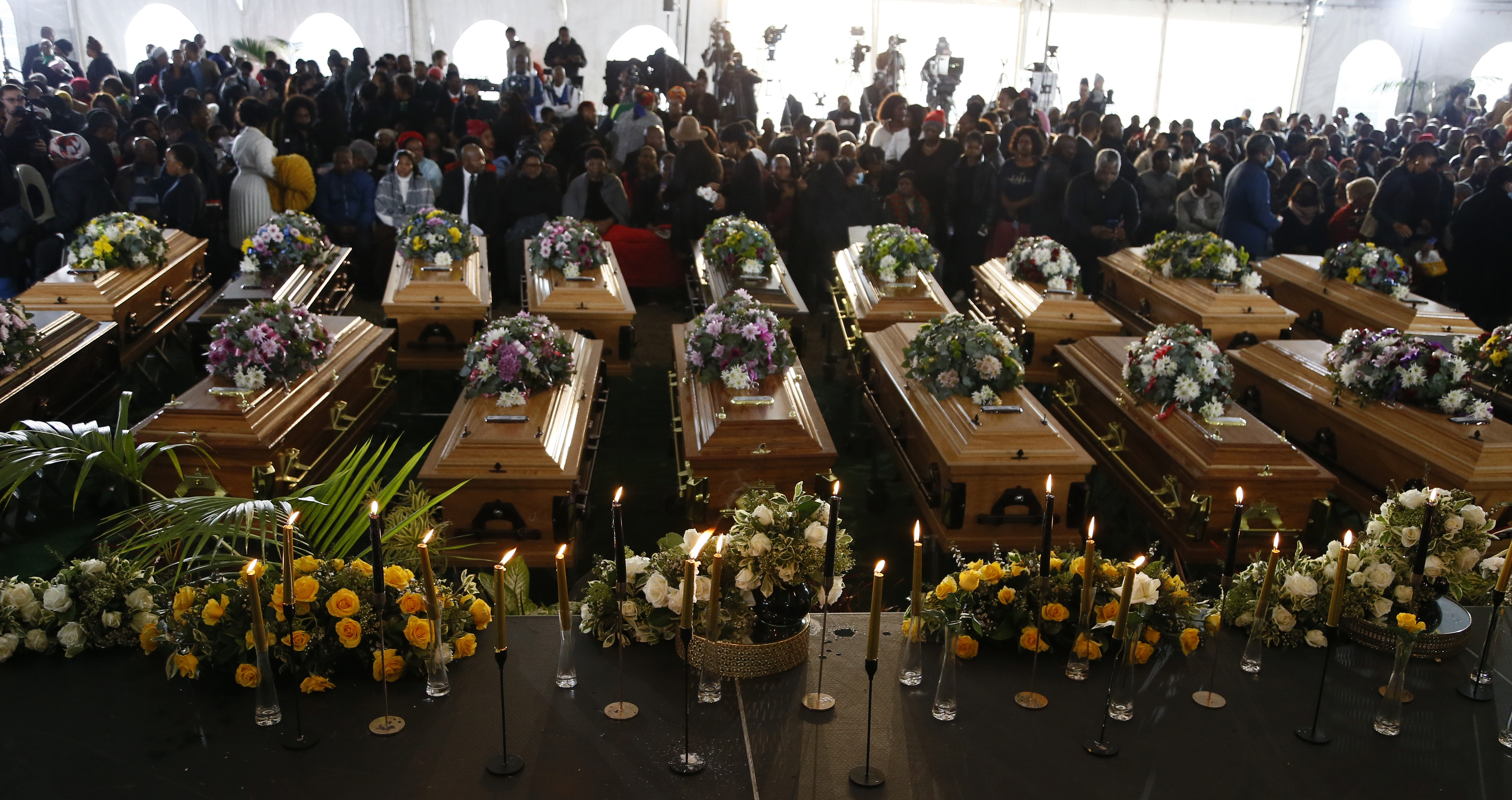 Tragic day as shattered families and friends gather to  'bury' the 21 Enyobeni Tavern victims