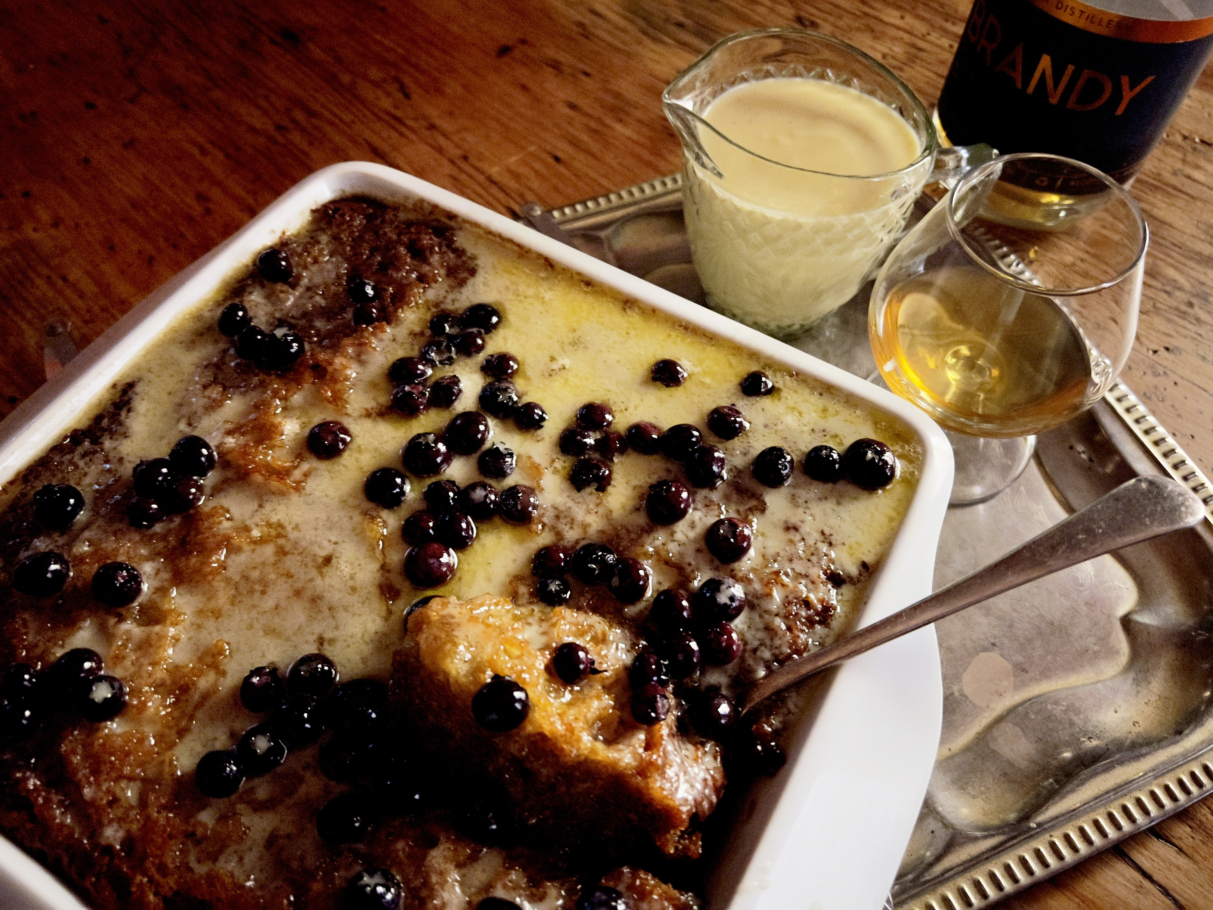 Brandy-orange Malva pudding with blueberries