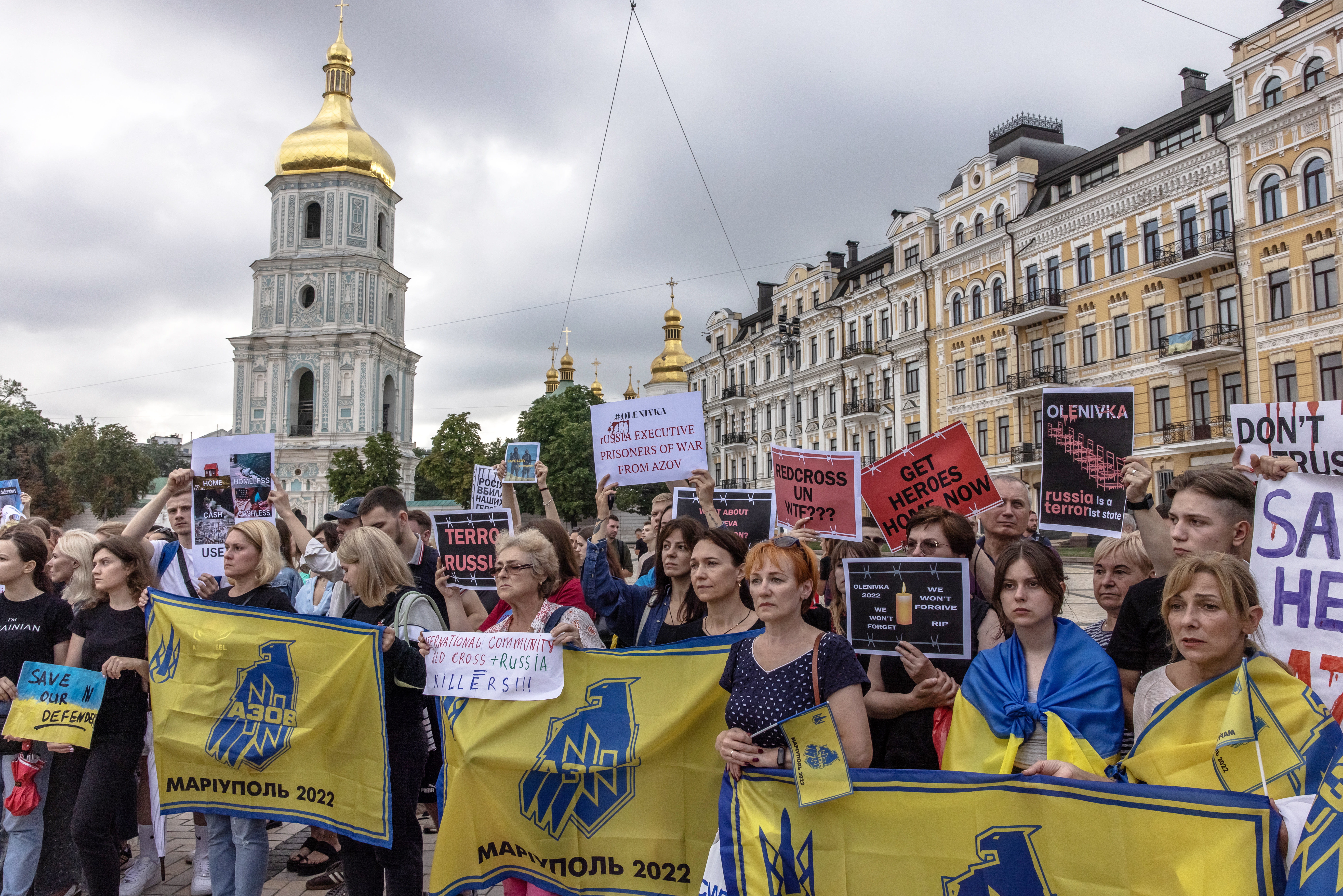 Relatives of the Azovstal defenders and others attend a rally in memory of those who were killed in the blast at Olenivka detention center