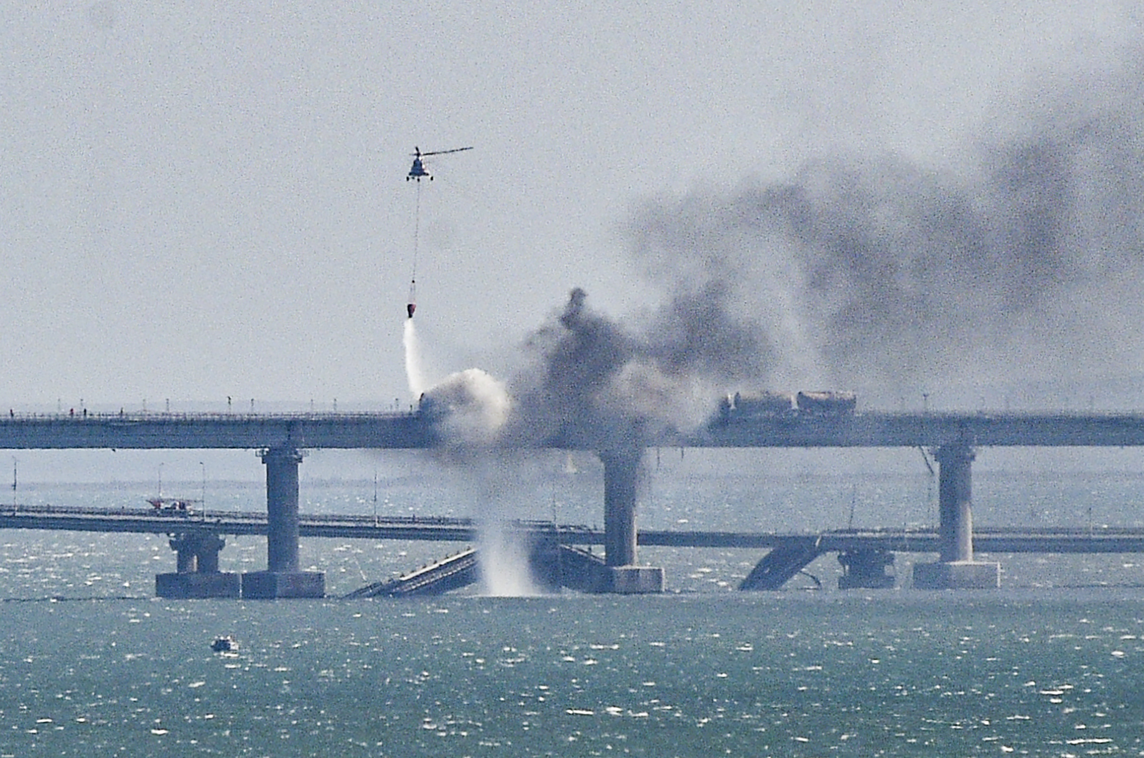 Parts of Crimea bridge collapse following fire