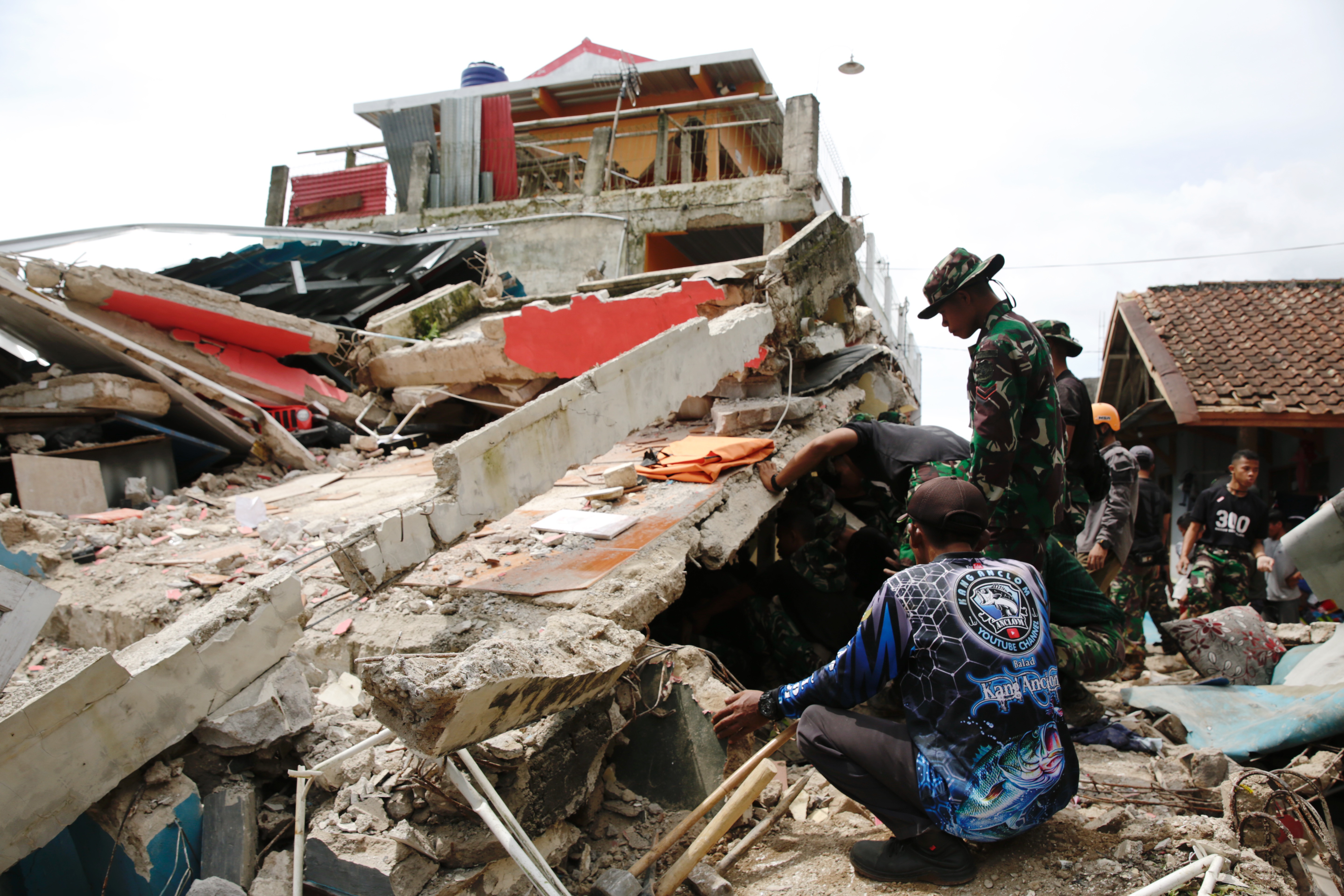 Rescuers search for survivors following a magnitude-5.6 earthquake in Indonesia