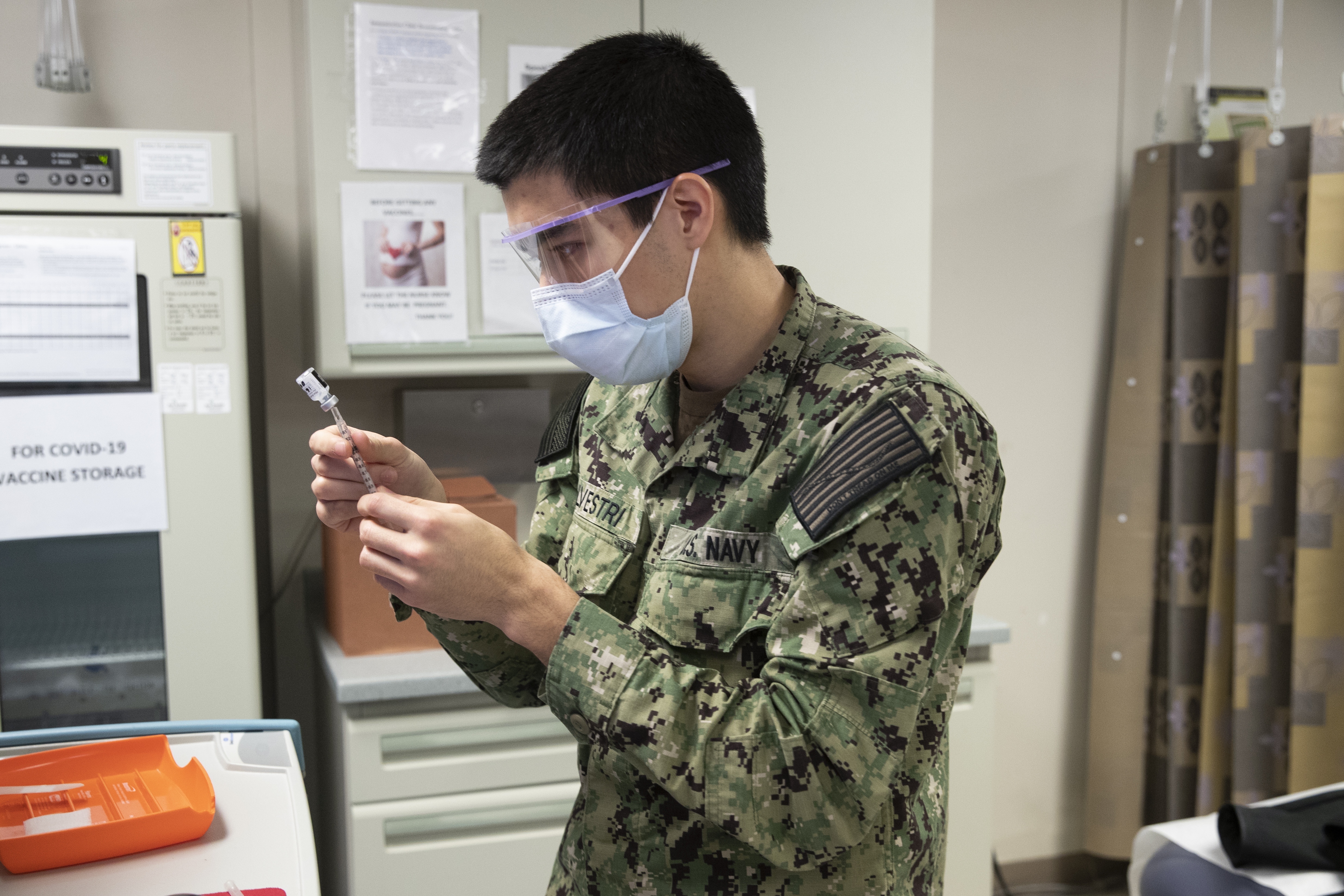 Pfizer-BioNTech COVID-19 vaccine is administered at Naval Medical Center Portsmouth (NMCP) in Portsmouth, Virginia