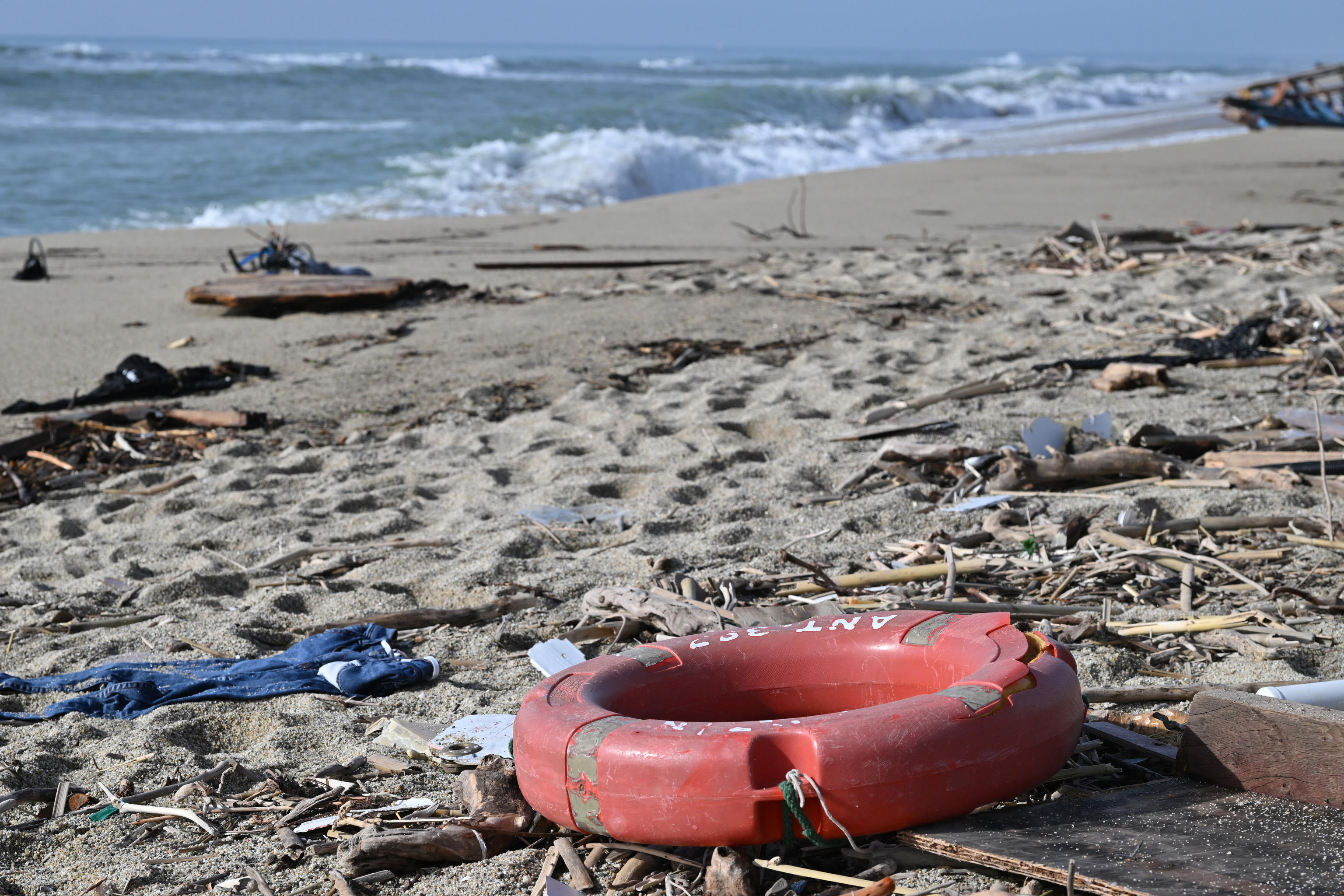 Debris washed up on Calabrian beach following deadly migrant shipwreck off Italy's southern coast