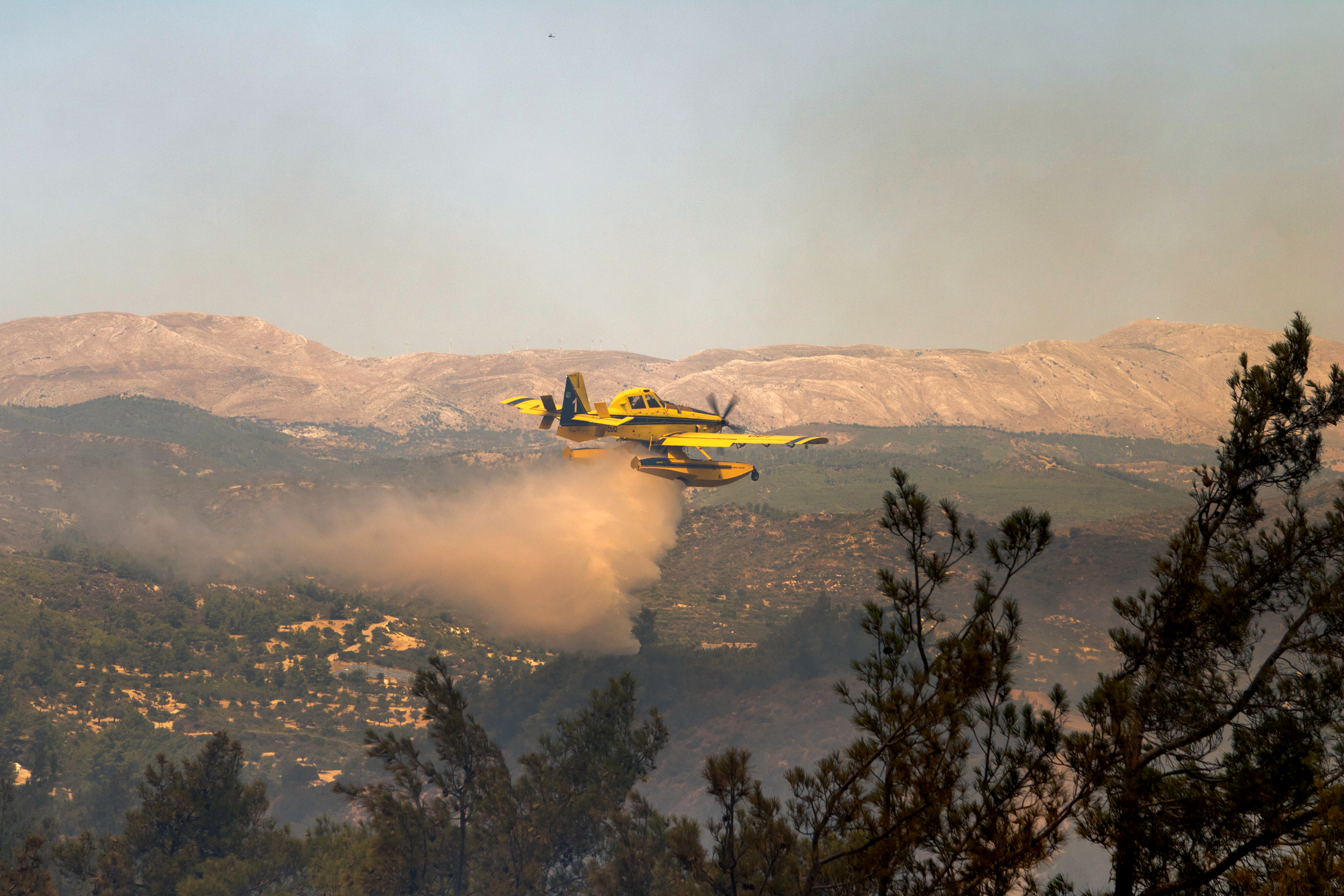 Greek island wildfires displace 19,000 in country’s biggest evacuation