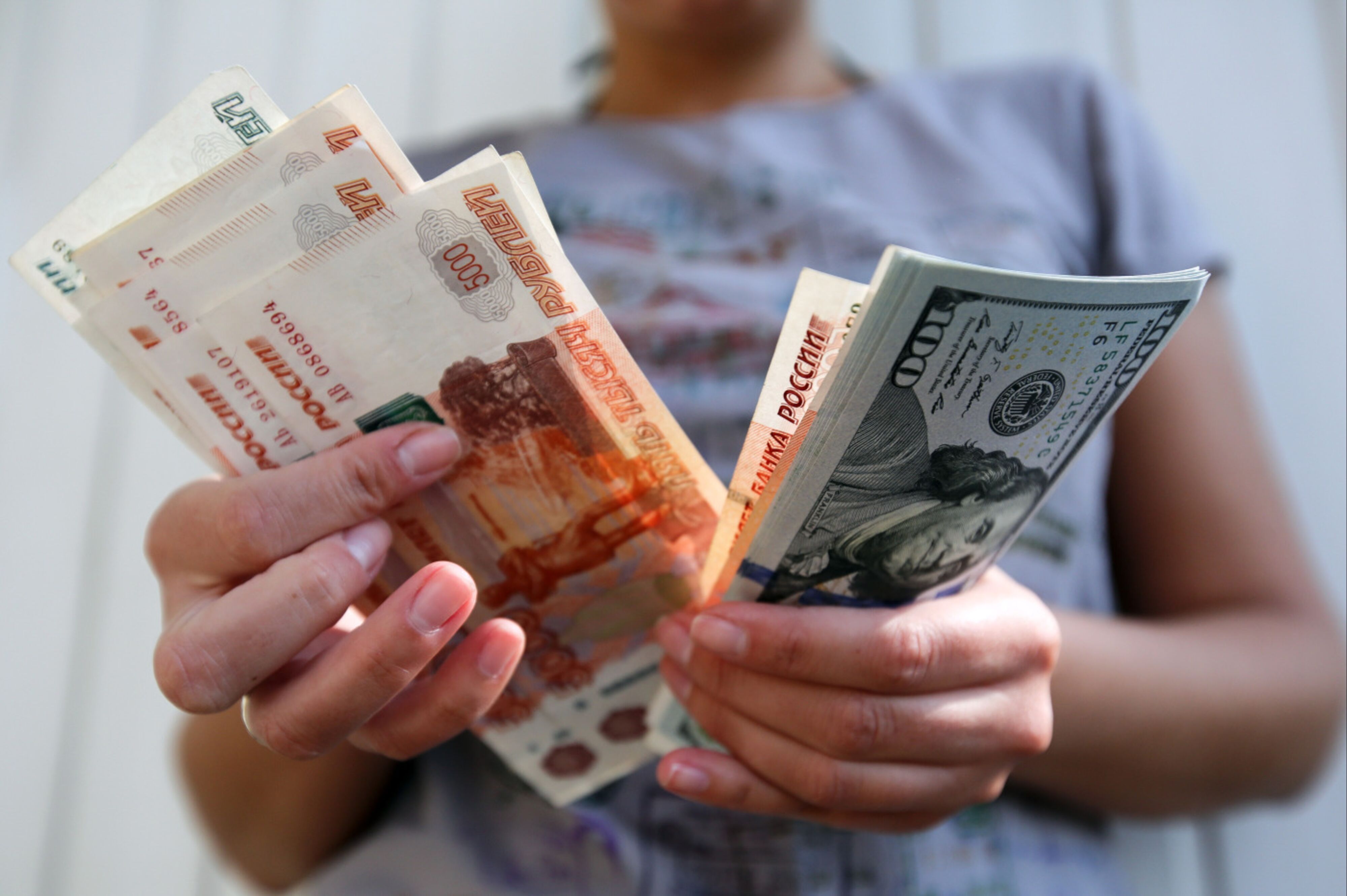 Ruble Crashes Through 100 Per Dollar Despite Central Banks Move