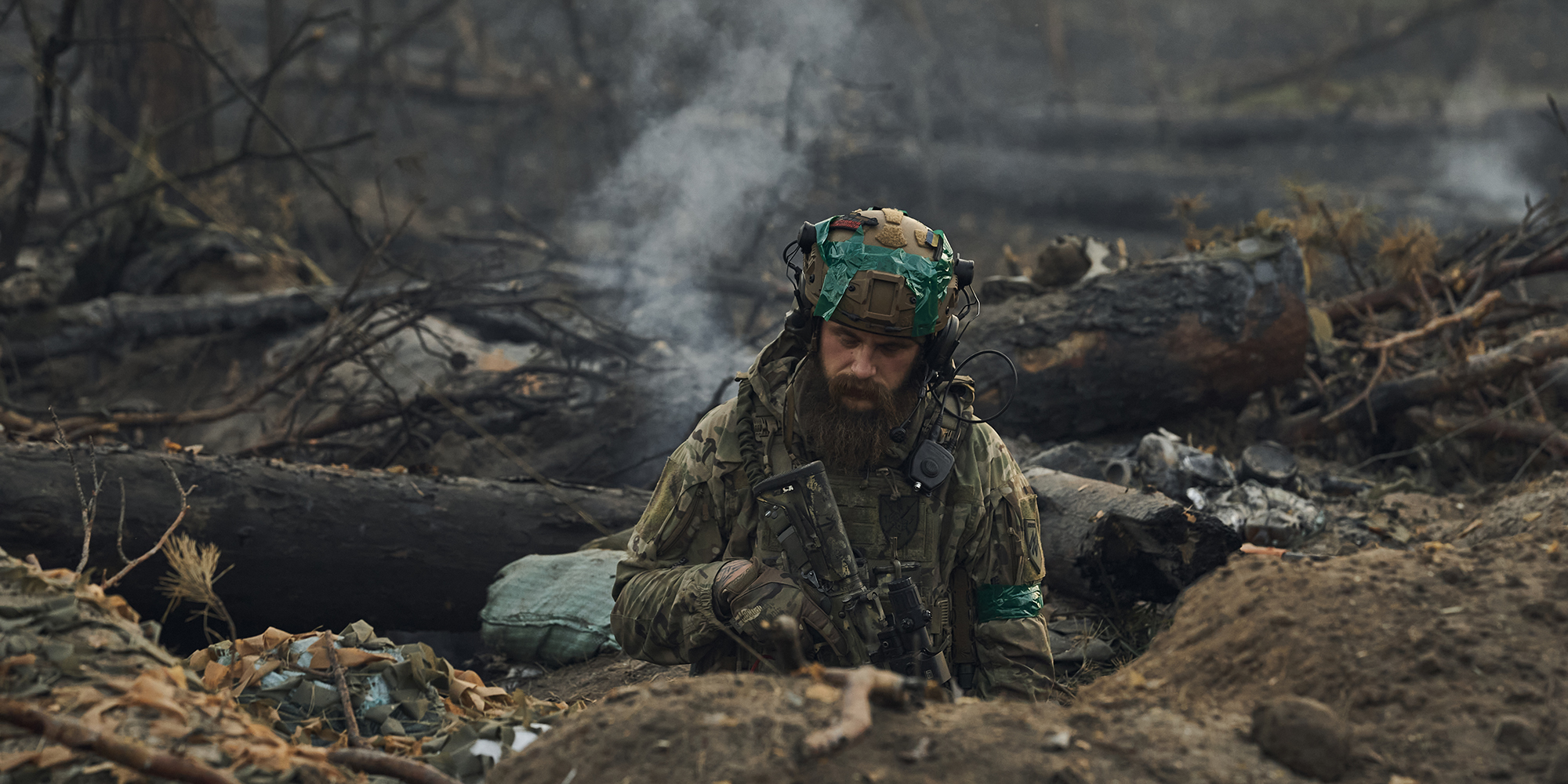 Portrait of a Ukrainian soldier with The M16 rifle in a bunker that burns after artillery fire during combat manoeuvers in the Kreminna Forest on 24 September 2023 near Kreminna, Luhansk region. (Photo: Getty Images / STR)