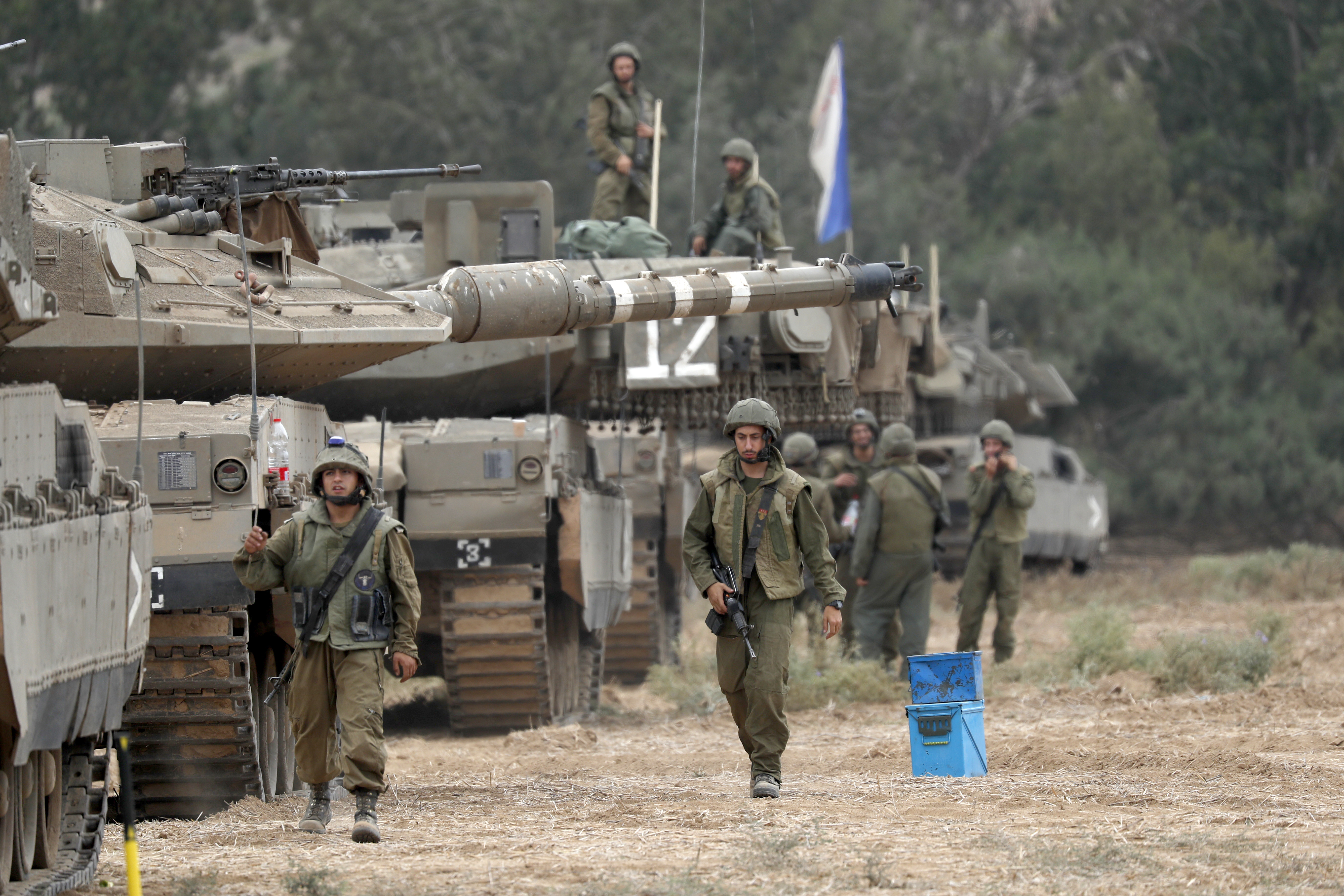 Israeli military tries to strengthen borders with Gaza as battle enters third day