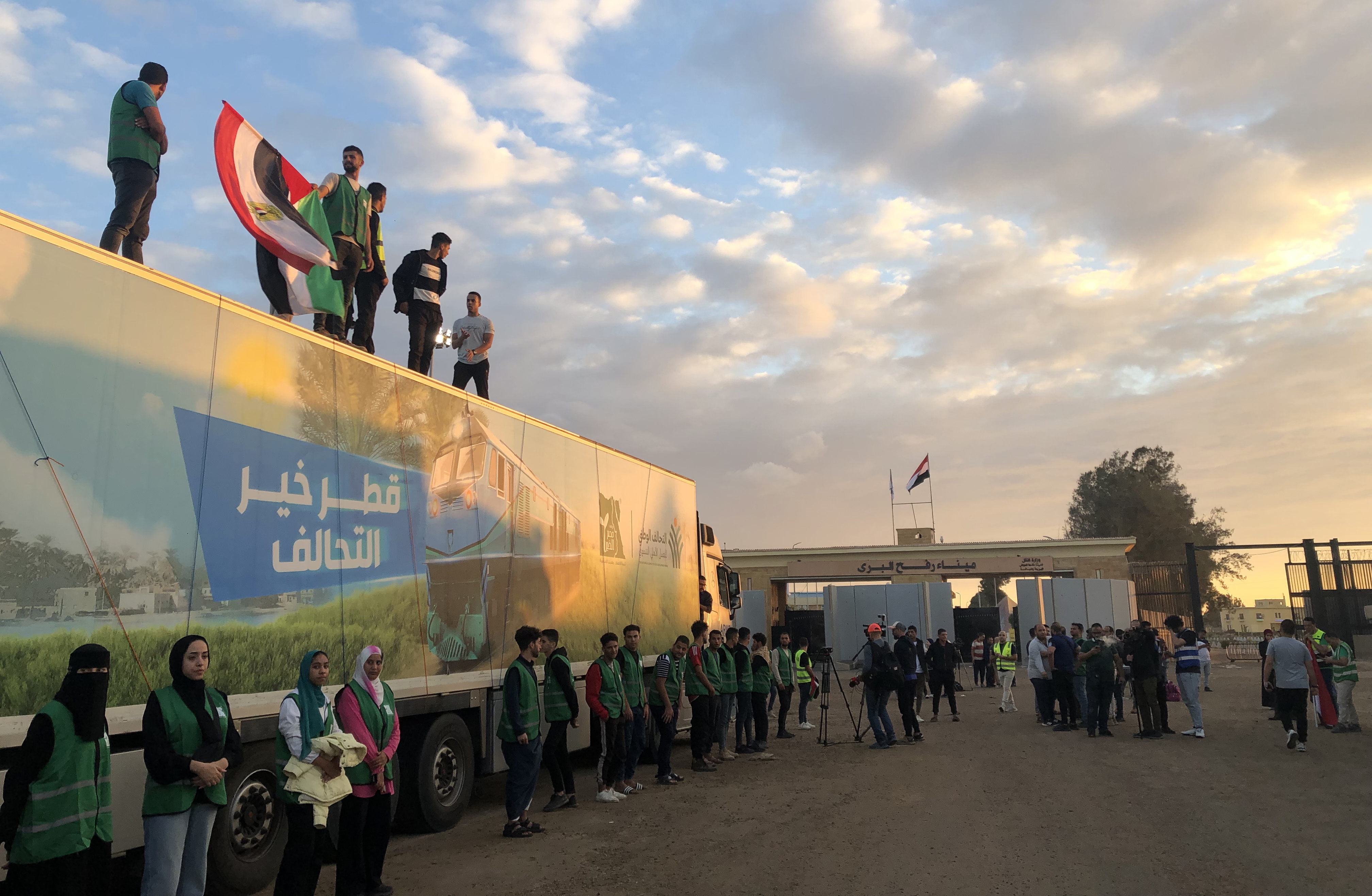 A blocked humanitarian aid convoy awaits outside Rafah border gate, Egypt
