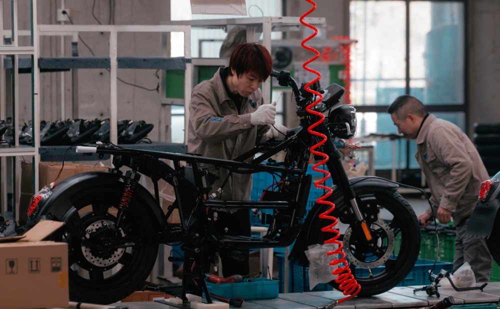 China factory activity shrinks as growth hurt by weak demand