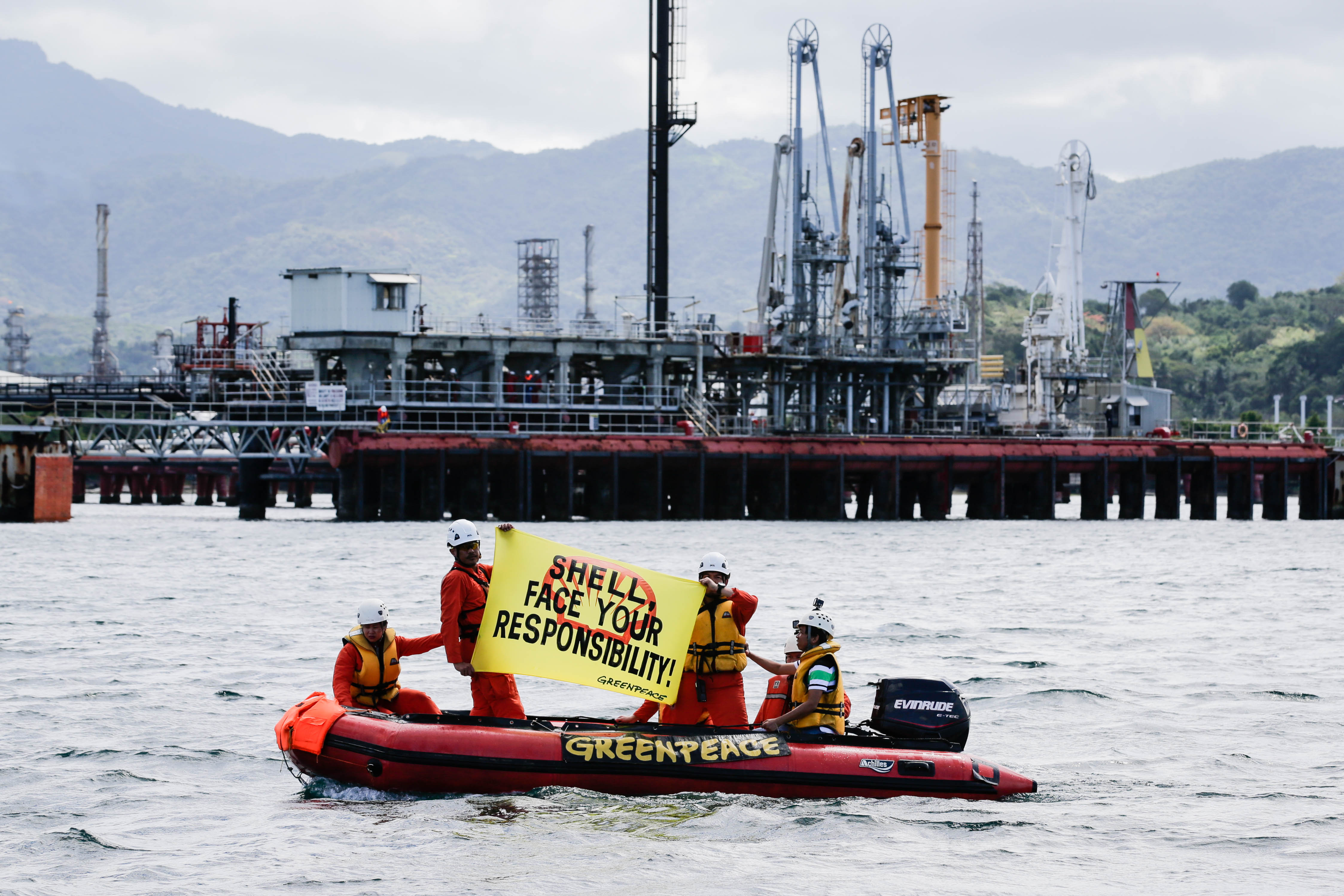 Greenpeace activists protest at a Shell oil refinery in Batangas