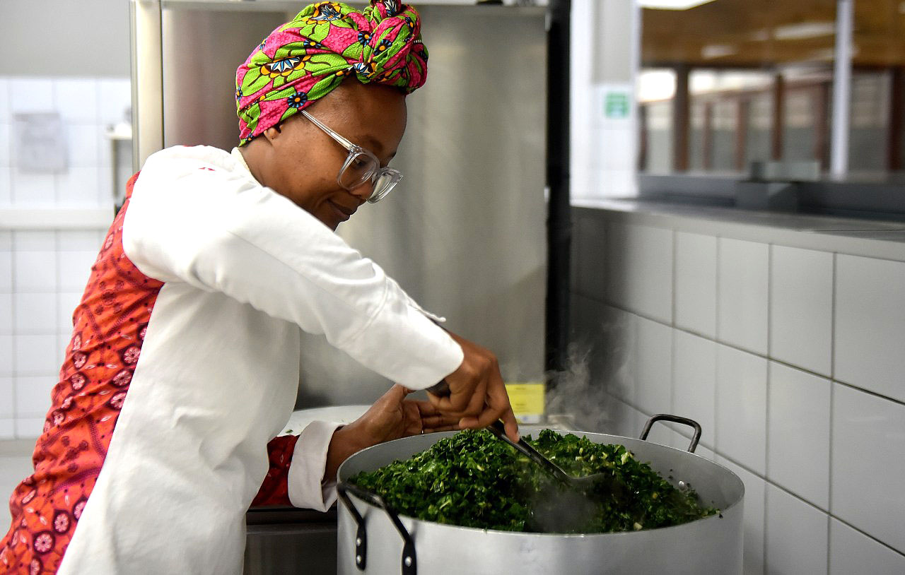 Khaya Kepe preparing food in Khaya’s Kitchen, Gqeberha, Eastern Cape. The food Imbizo said traditional foods such as wild spinach can be a solution to curb food insecurity but will need to be brought back "in style" (Photo: Deon Ferreira)