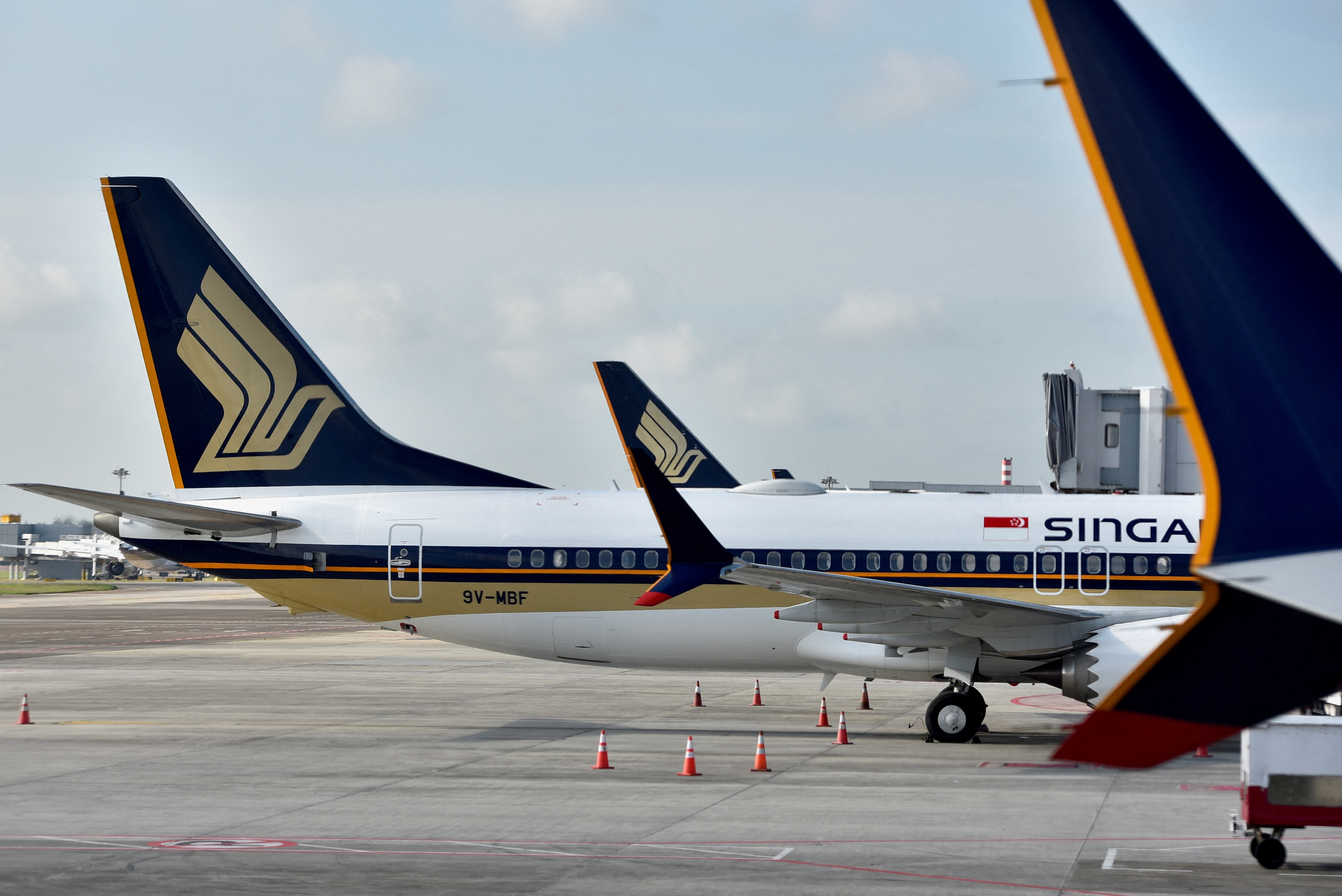 FILE PHOTO: Singapore Airlines planes sit on the tarmac at Changi Airport in Singapore