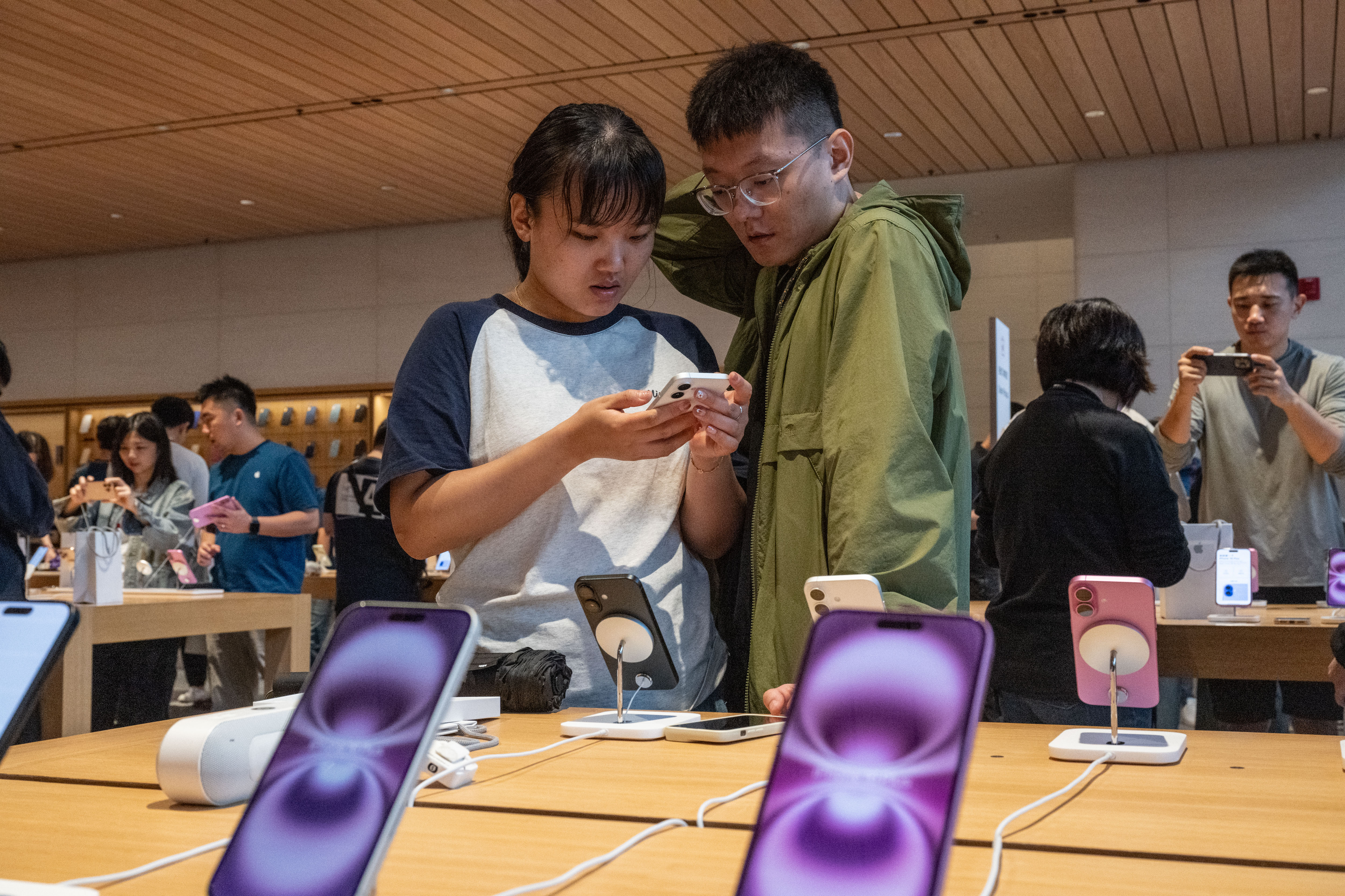 Customers at the Apple Sanlitun store in Beijing.