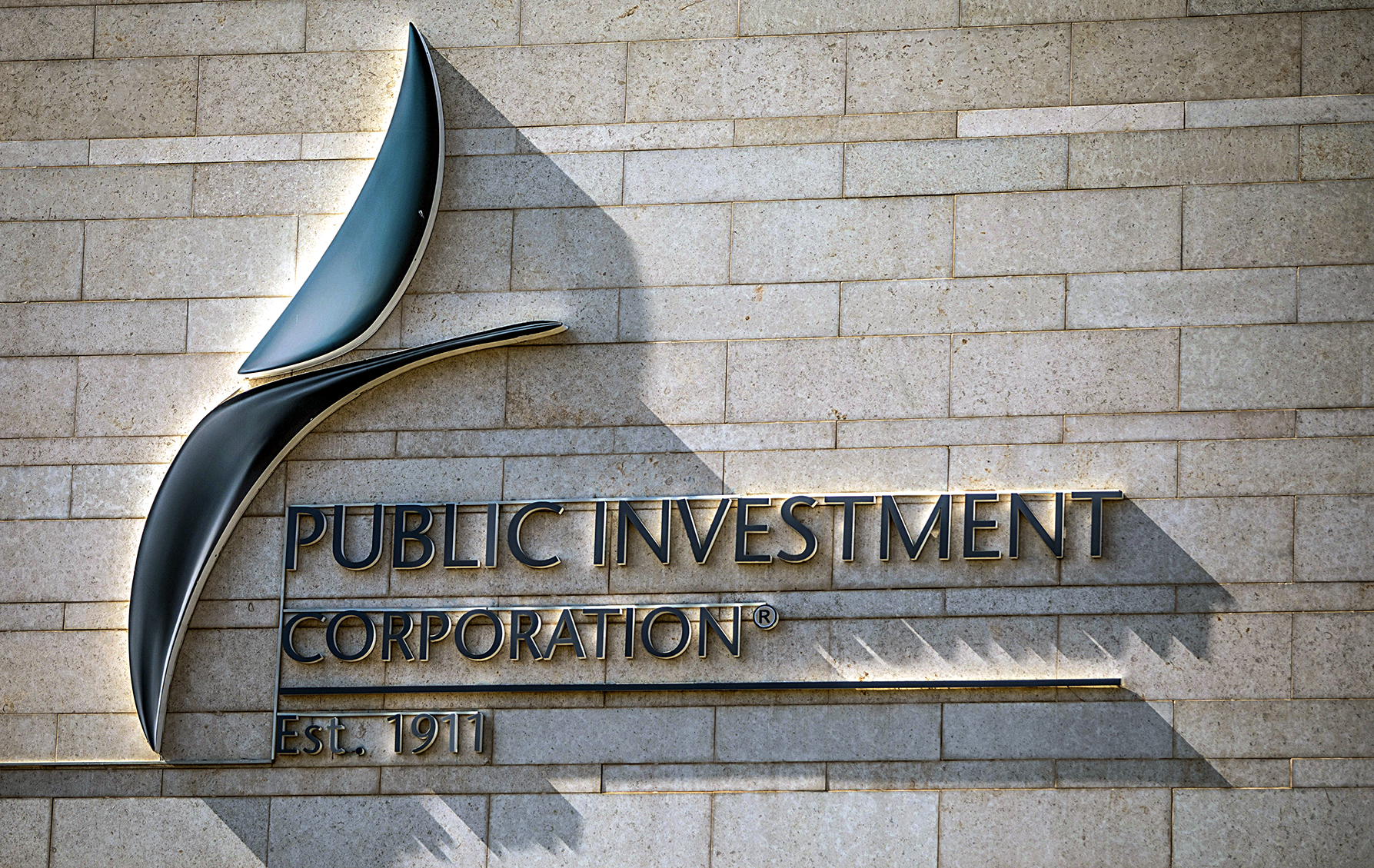 Signage for the Public Investment Corporation on the exterior of a commercial office building in Pretoria, South Africa, 21 May 2021. (Photo: Guillem Sartorio / Bloomberg via Getty Images)