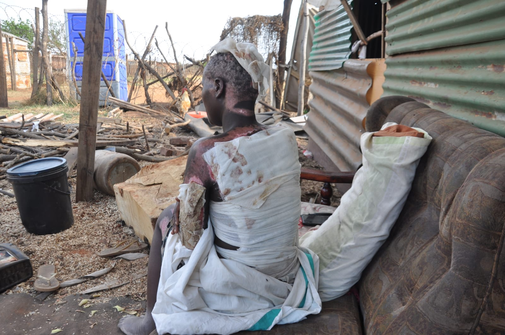 Families demand justice after informal miners burn to death during police raid