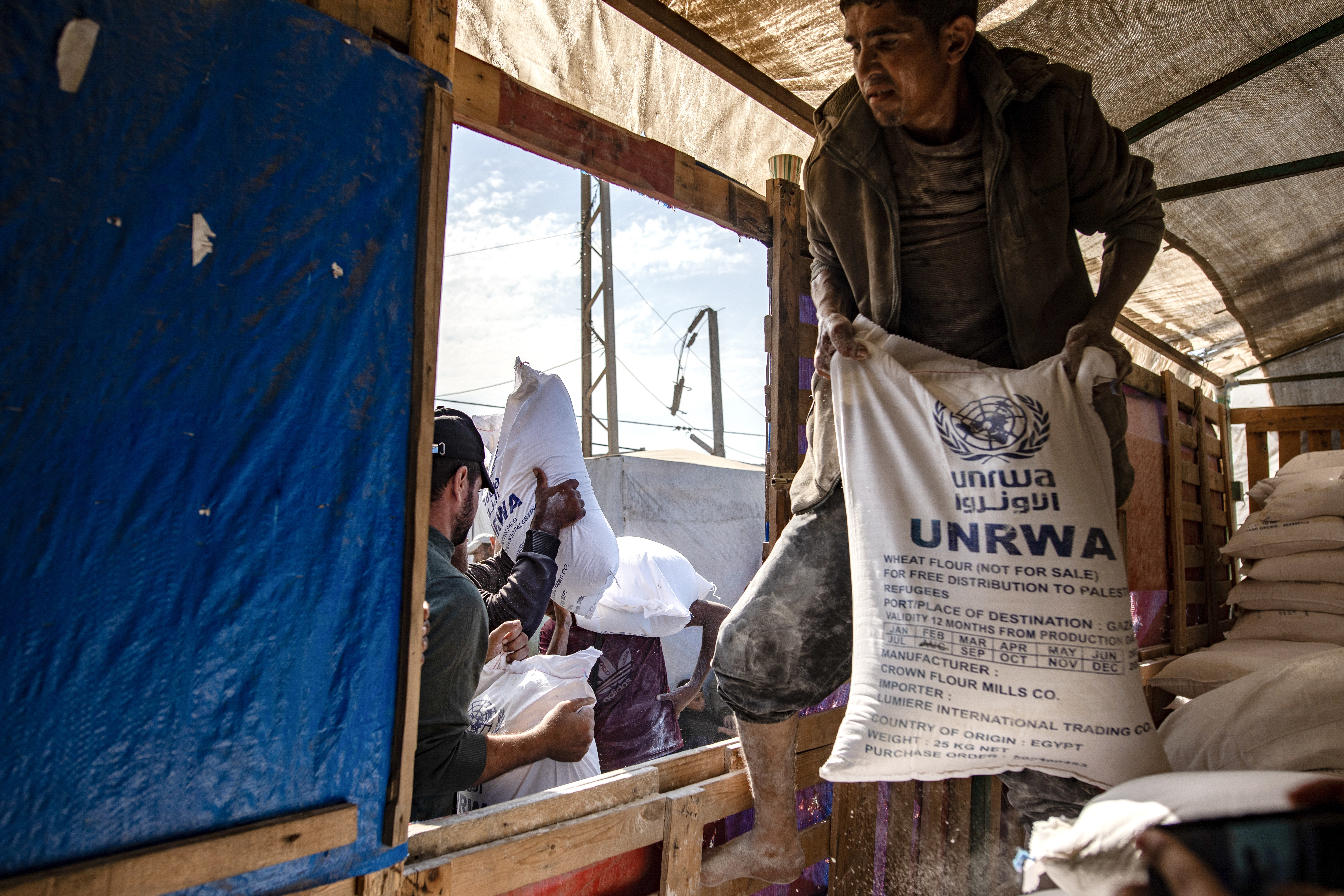 UNRWA agency hands out bags of flour to Palestinians in Khan Younis