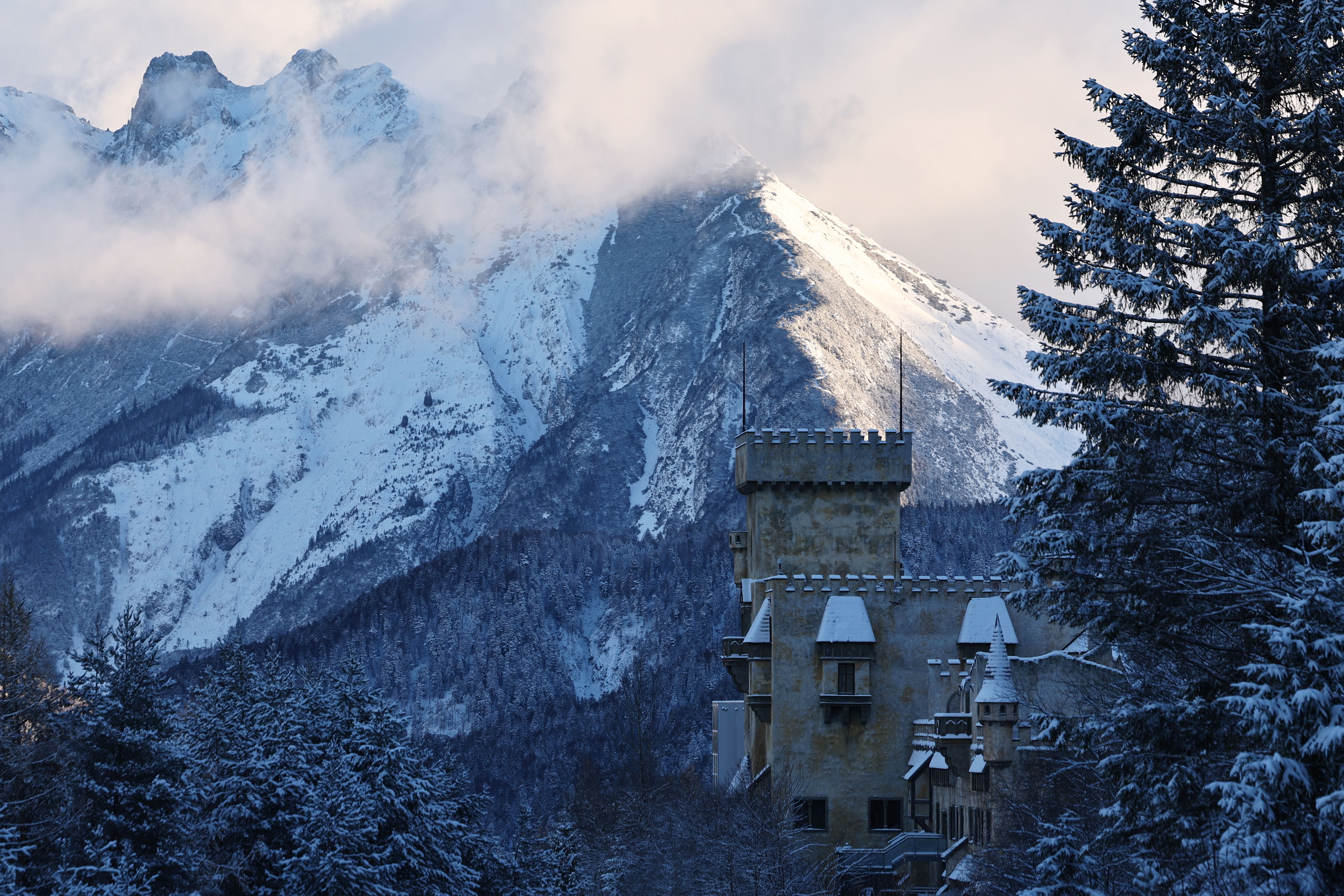 epa11734415 A view of the Magic Castle Seefeld with snow-covered trees and mountains in Seefeld, Austria, 22 November 2024.  EPA-EFE/ANNA SZILAGYI
