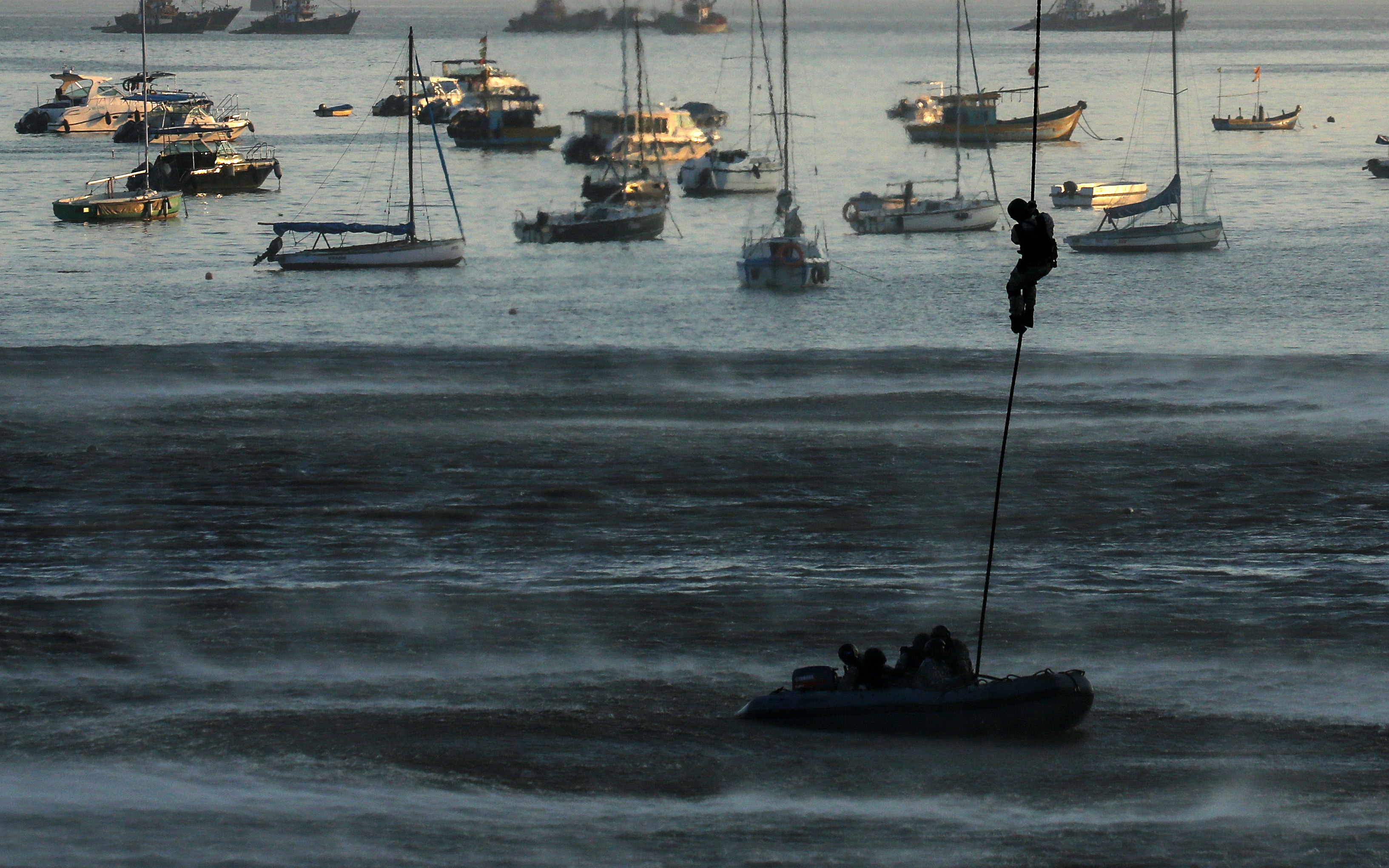 Indian Navy marine commandos demonstrate their rescue operation skills during Navy Day celebrations in Mumbai, India, 04 December 2021. EPA-EFE/DIVYAKANT SOLANKI