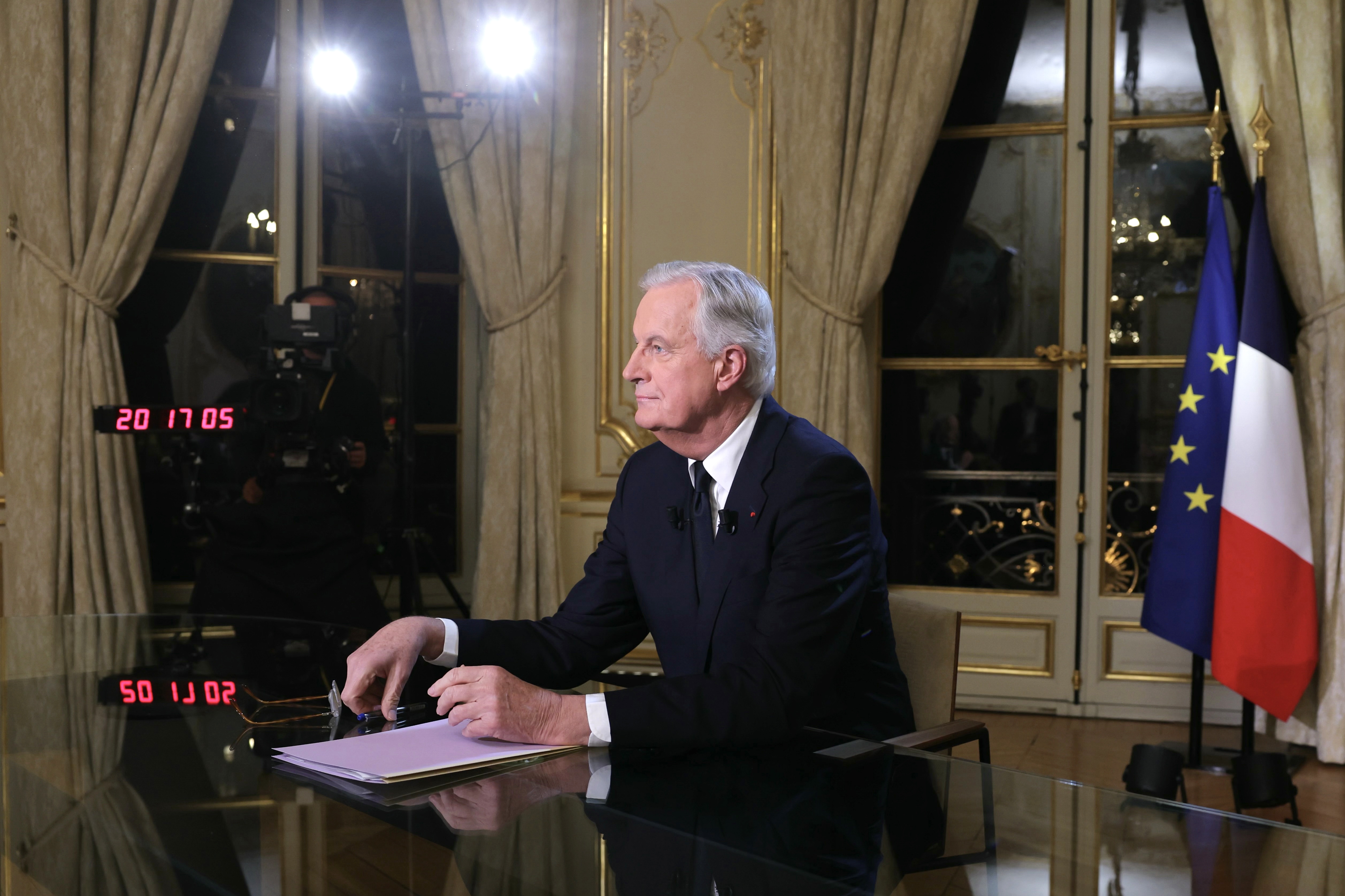 French Prime Minister Barnier delivers remarks during a televised interview in Paris