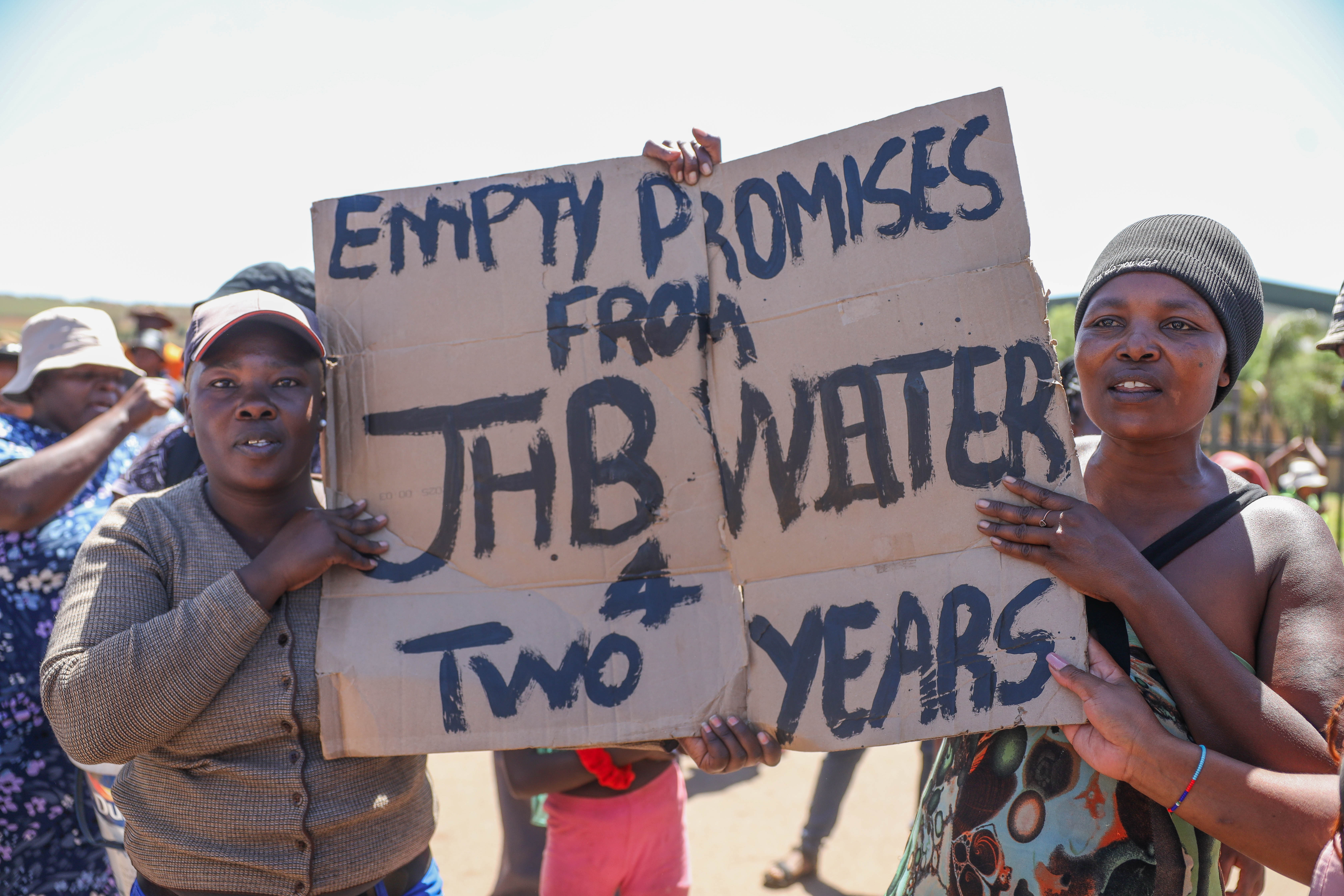 Phumlamqashi residents during a protest against water cuts in Lenasia South on 2 December 2024. The protests follow an operation to disconnect illegal water connections. (Photo: Gallo Images / Sharon Seretlo).
