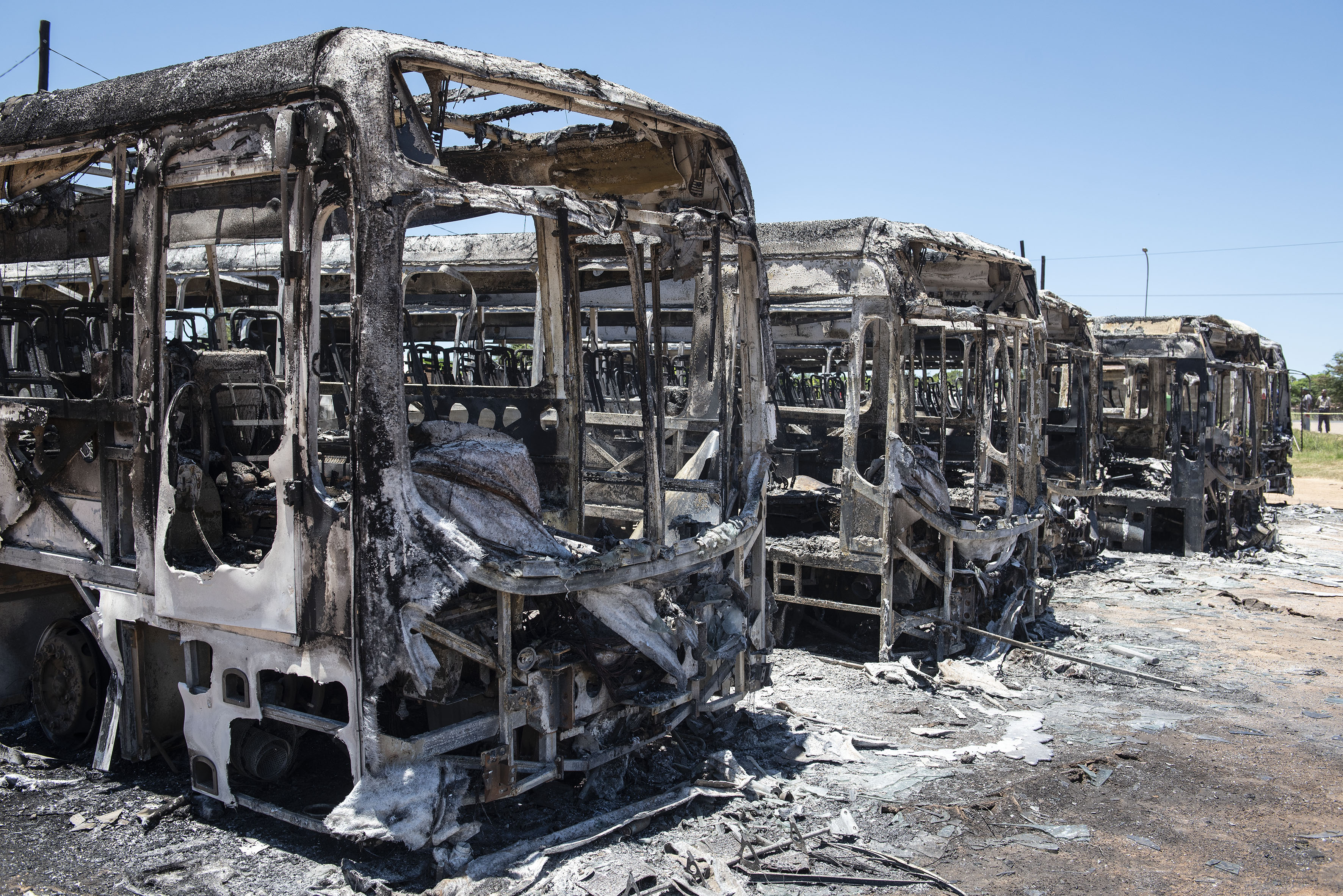 Police hunt at least 30 suspects after 51 Putco buses are torched