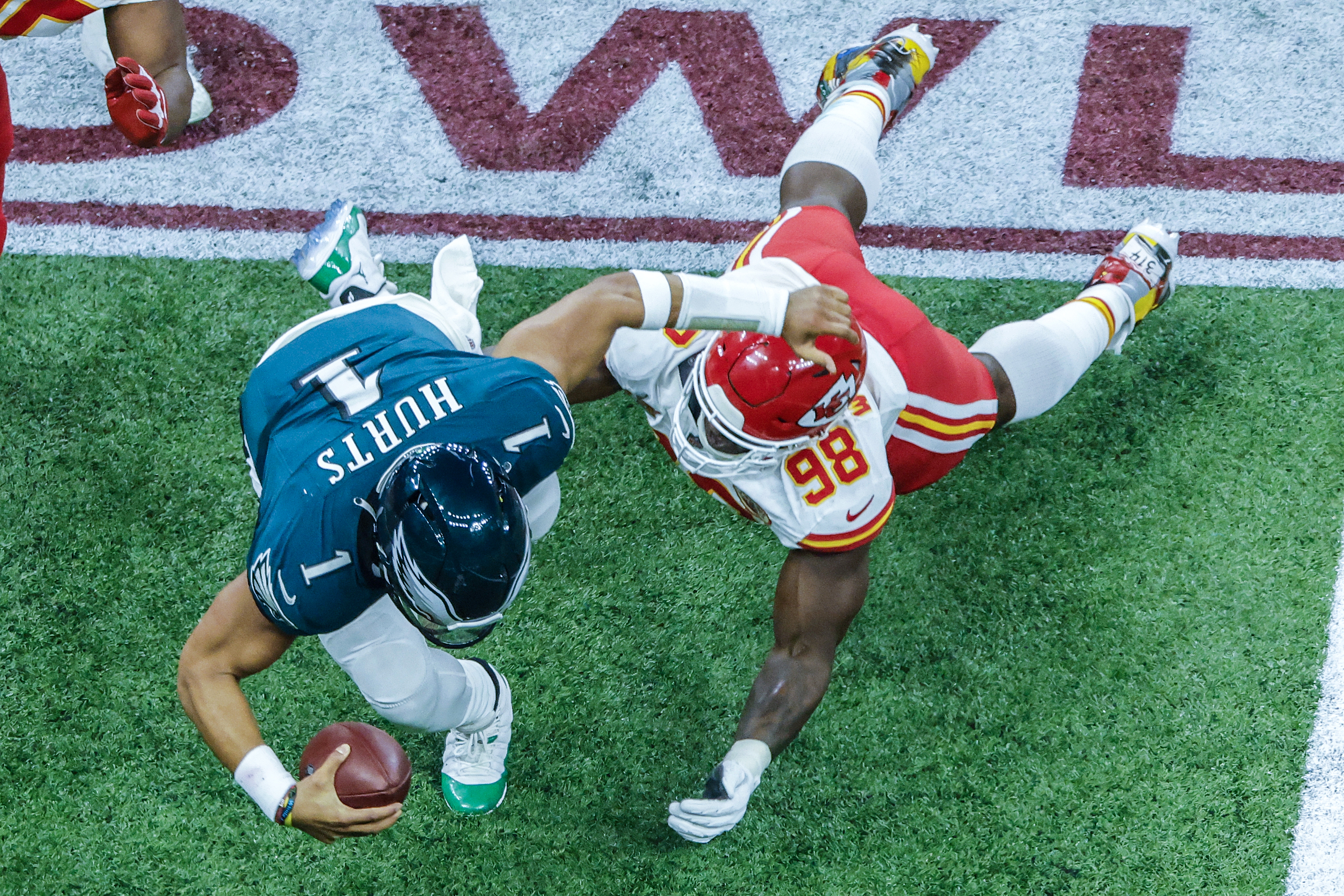 Philadelphia Eagles quarterback Jalen Hurts (L) in action against Kansas City Chiefs defensive tackle Tershawn Wharton during the first half of Super Bowl LIX between the Kansas City Chiefs and the Philadelphia Eagles at Caesars Superdome in New Orleans, Louisiana, USA, 09 February 2025. The Super Bowl is the annual championship game of the NFL between the AFC Champion and the NFC Champion and has been held every year since 1967.  EPA-EFE/CJ GUNTHER