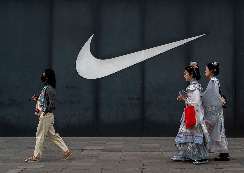People pass by a Nike store in a commercial district on April 8, 2025 in Beijing, China. China announced plans Friday to impose a 34% tariff on imports of all U.S. products starting from April 10, in retaliation following U.S. President Donald Trump's Liberation Day tariff announcement. The new tariff is the same rate of 34% on Chinese exports that Trump ordered earlier. President Trump has threatened to impose an additional 50 percent tariff if China doesn't walk back its measures. (Photo by Kevin Frayer/Getty Images)