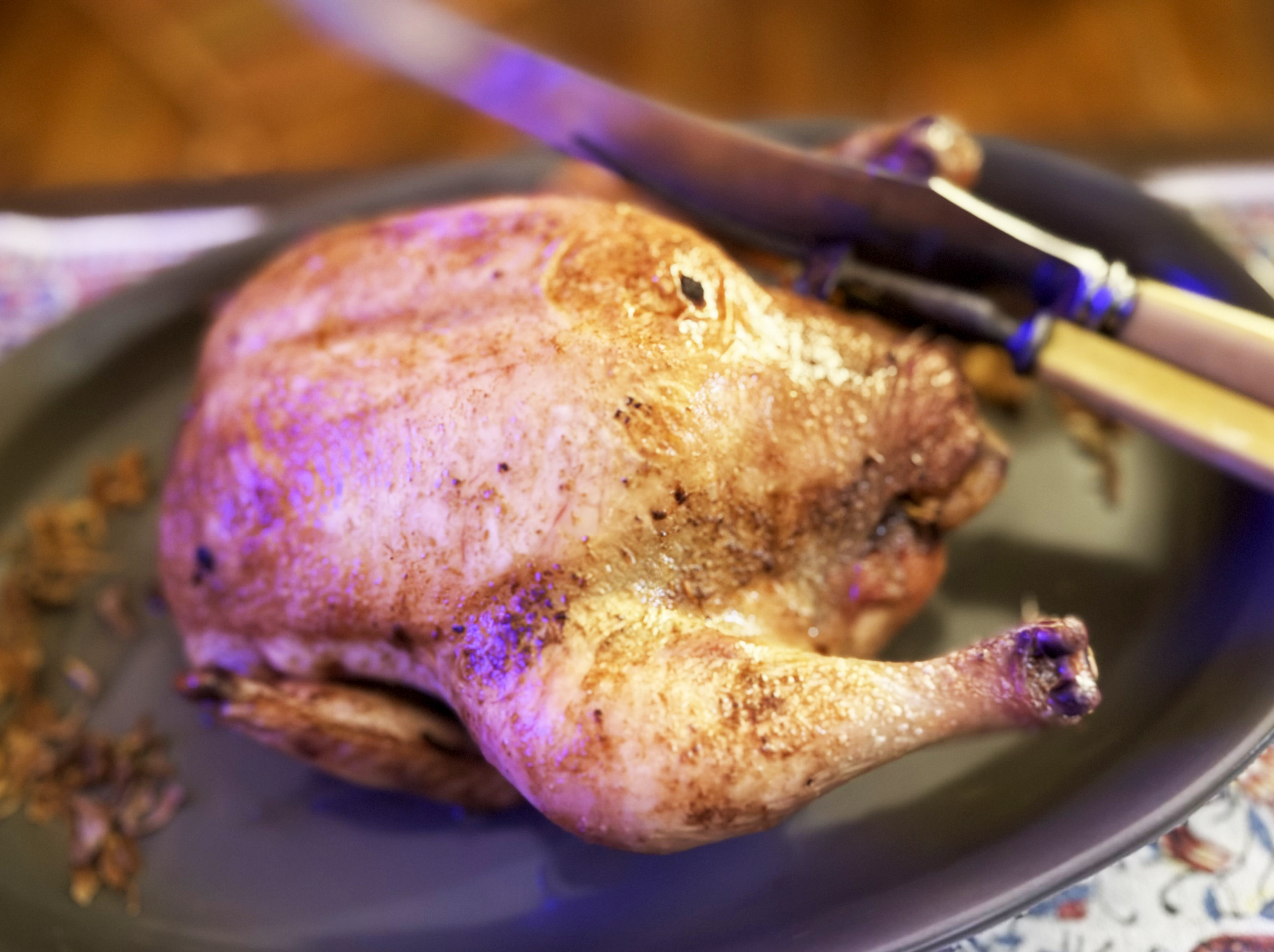 Roast chicken with mace butter and orange-chorizo stuffing