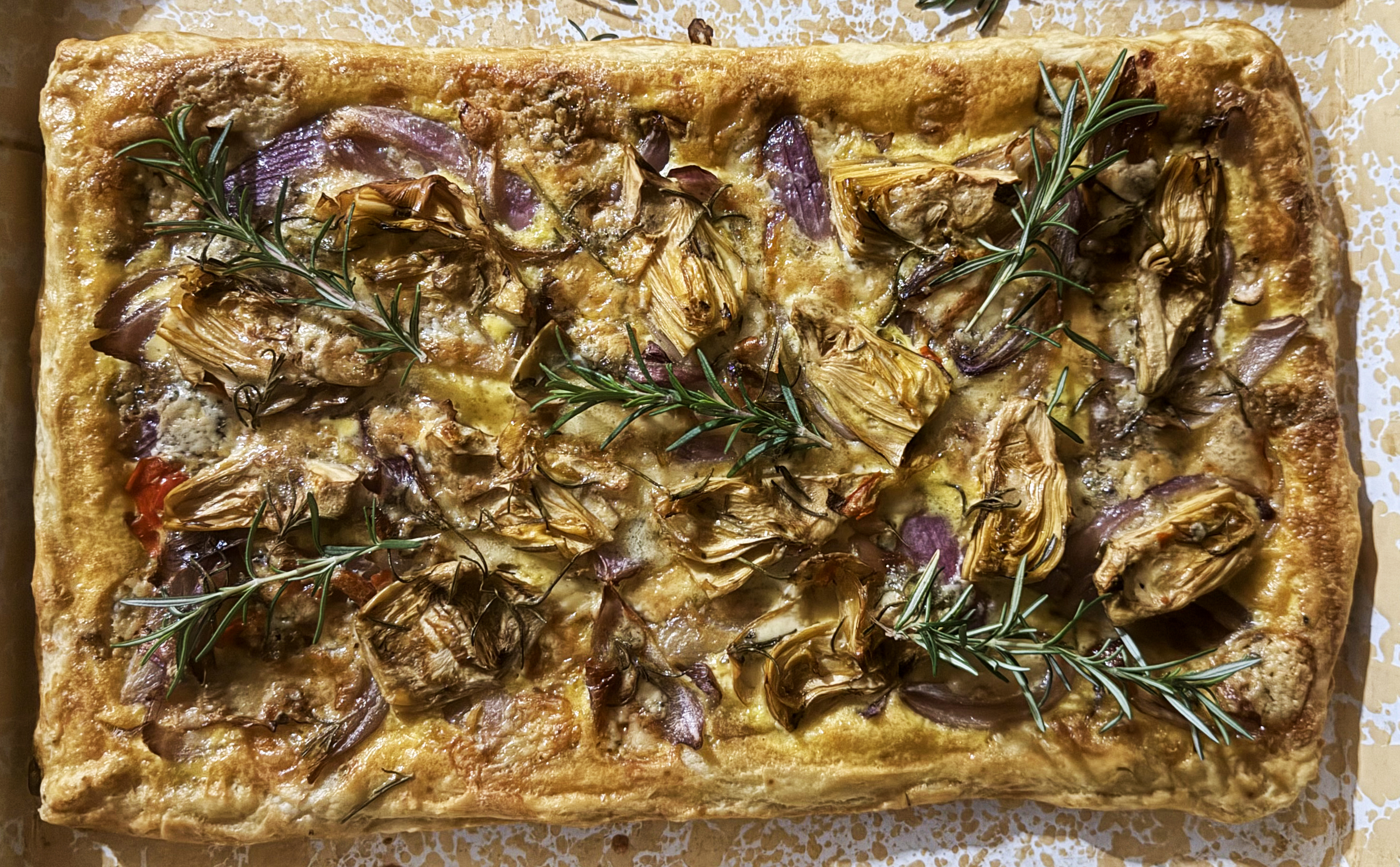 Rustic artichoke, red onion and blue cheese tart