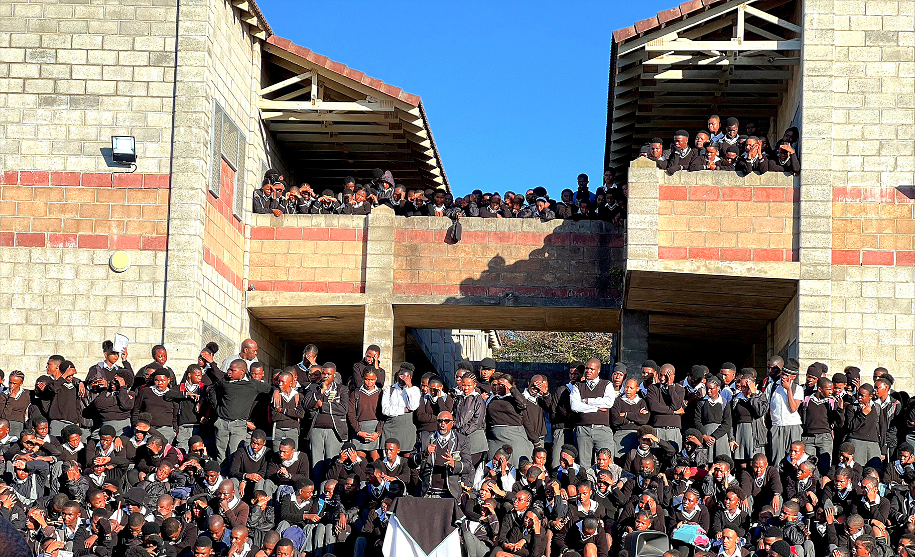 Lunga Dyani ddresses his learners for the final time as school principal. He told them to continue working hard, and to achieve a 100% matric pass rate. (Photo: Nkosazana Ngwadla)
