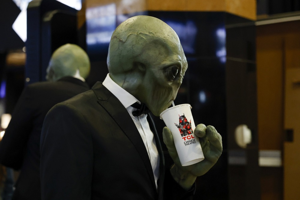 A person dressed in an alien costume sips on a drink while attending the movie premiere 'Run' at the TCL Chinese Theatre in Los Angeles, California, USA, 27 August 2025.  EPA/CAROLINE BREHMAN