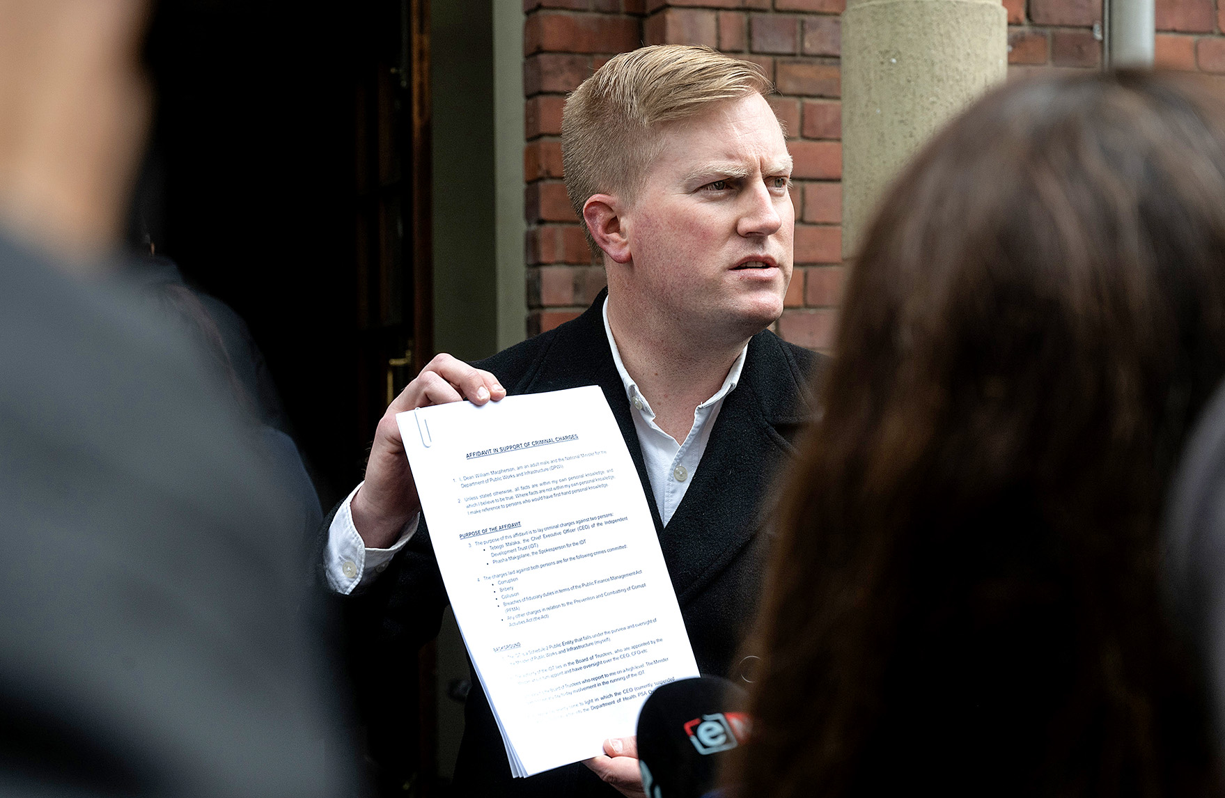 ‘Sick to my stomach’ — Minister Macpherson lays criminal charges against suspended IDT CEO, spokesperson