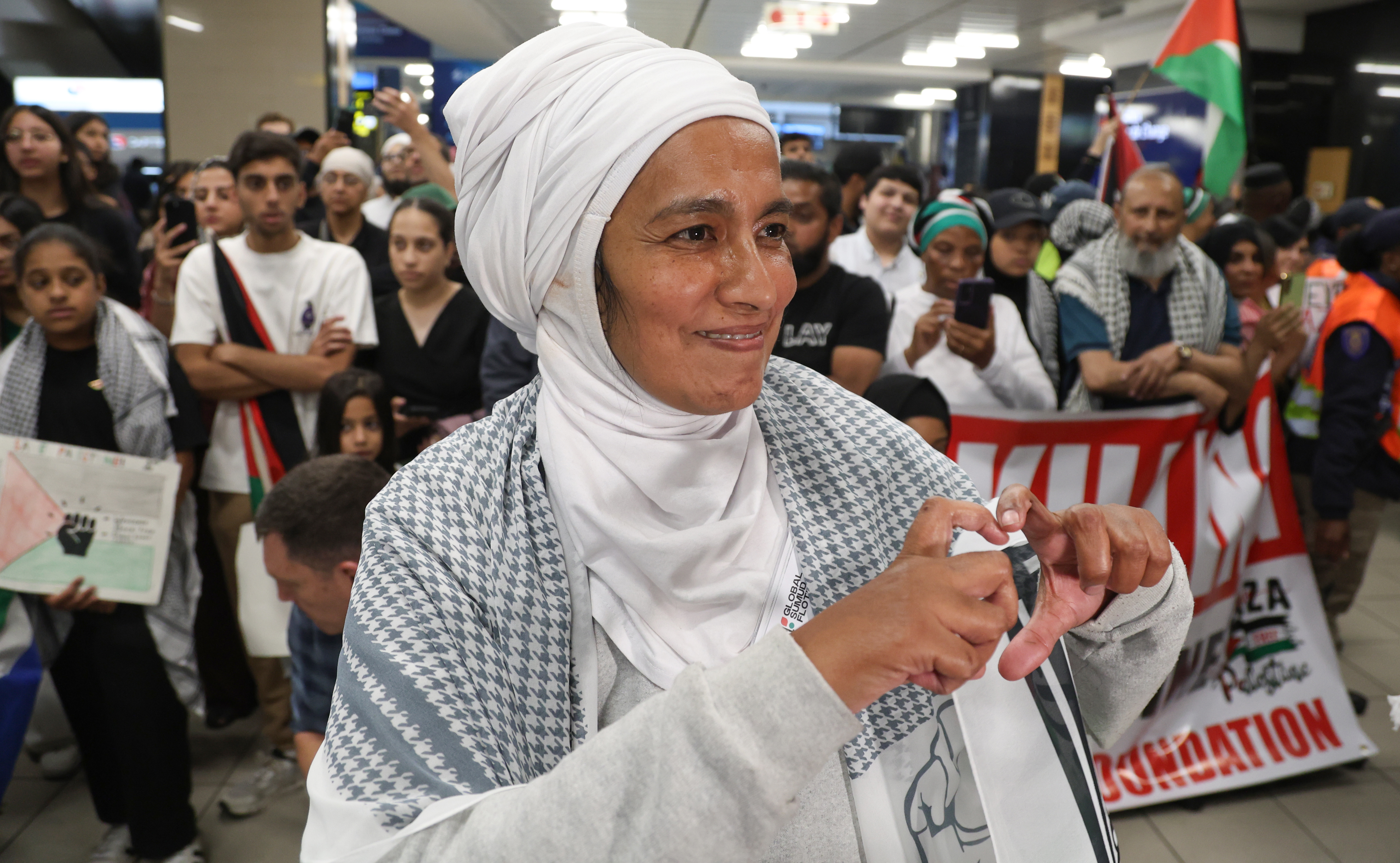 Supporters welcome home South African activists after Global Sumud Flotilla interception