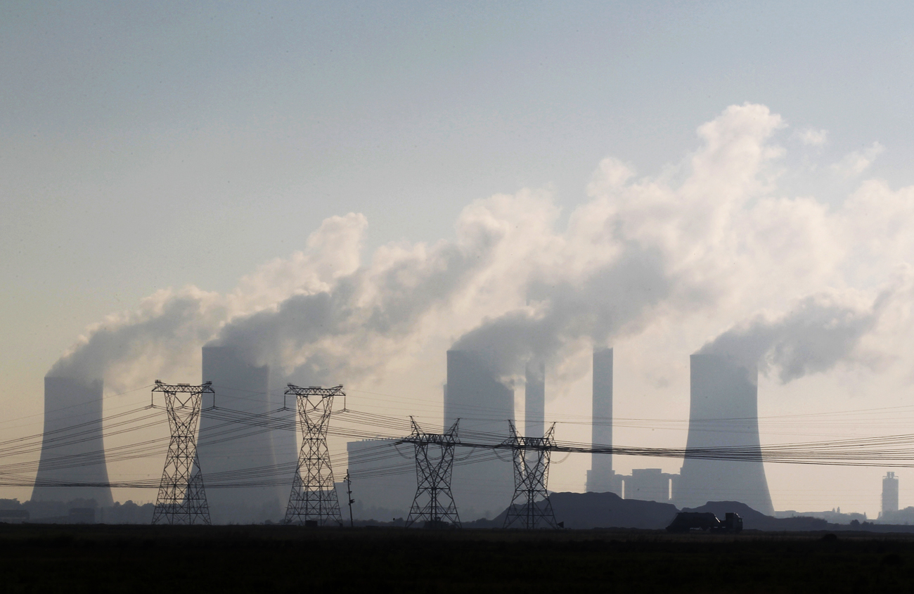A truck drives past electricity pylons at the Lethabo Power Station in the Free State Province